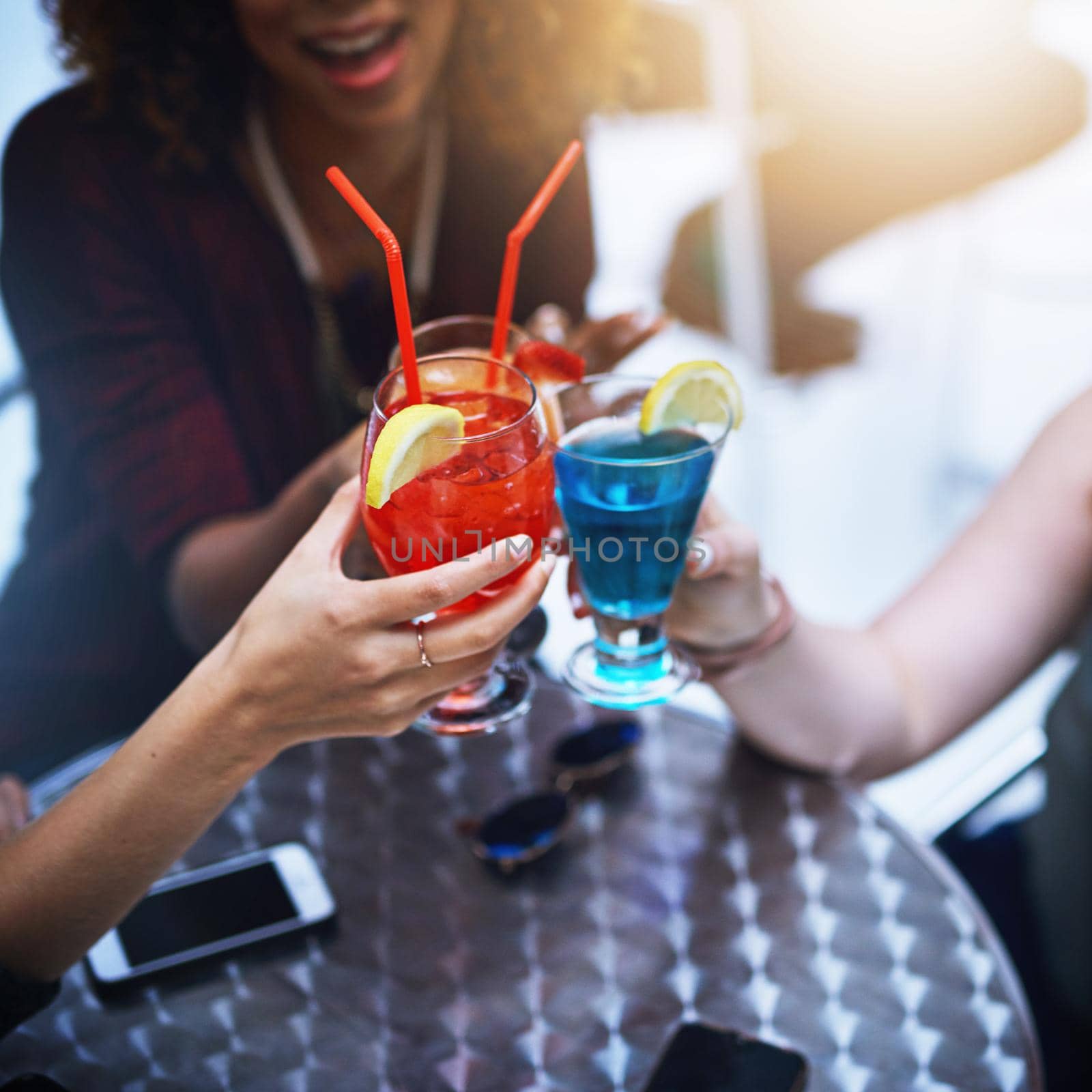 Cropped shot of a group of friends having drinks together at a party.