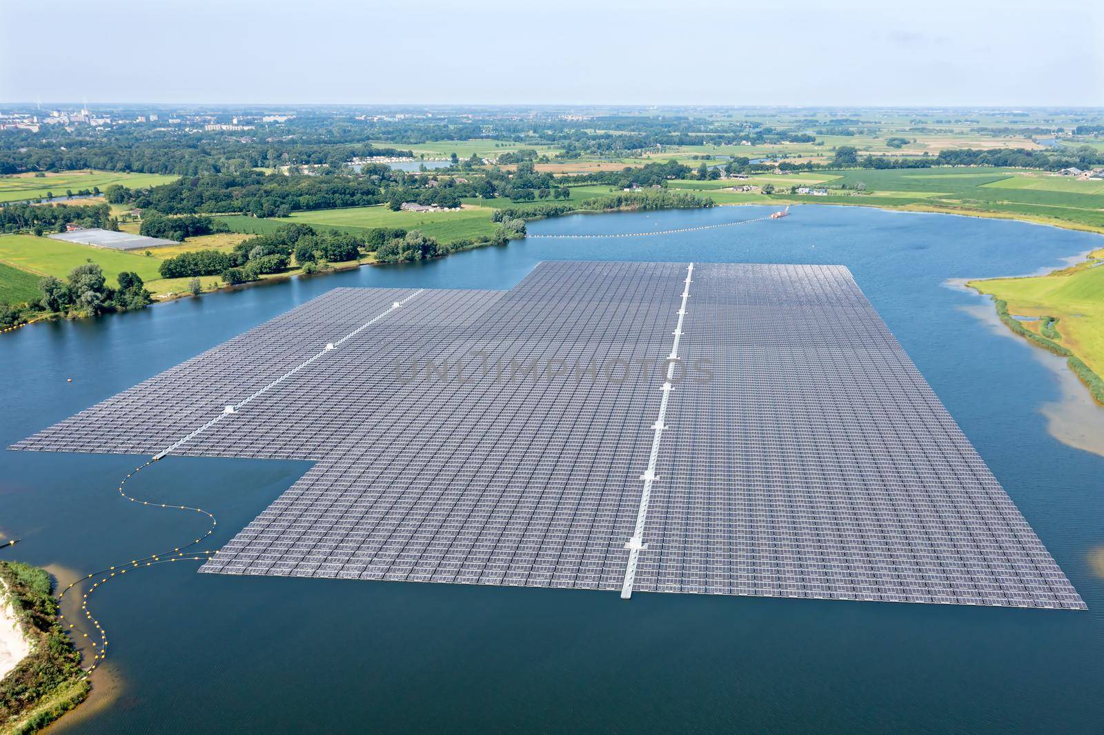 Aerial view from solar panels on a lake in the countryside from the Netherlands