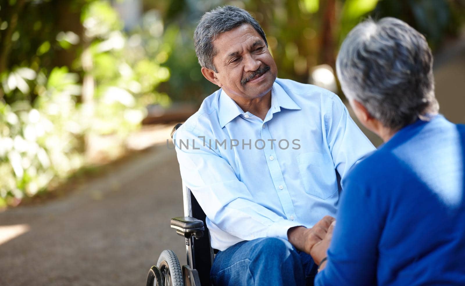 Cropped shot of a senior couple talking outdoors.
