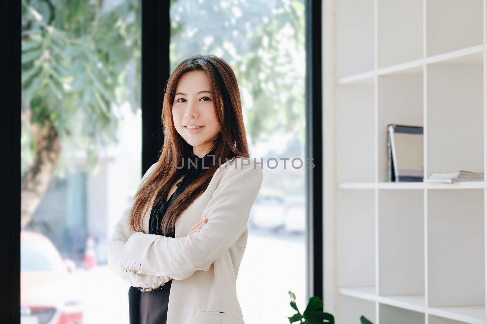 female entrepreneur showing a happy smiling face. by Manastrong