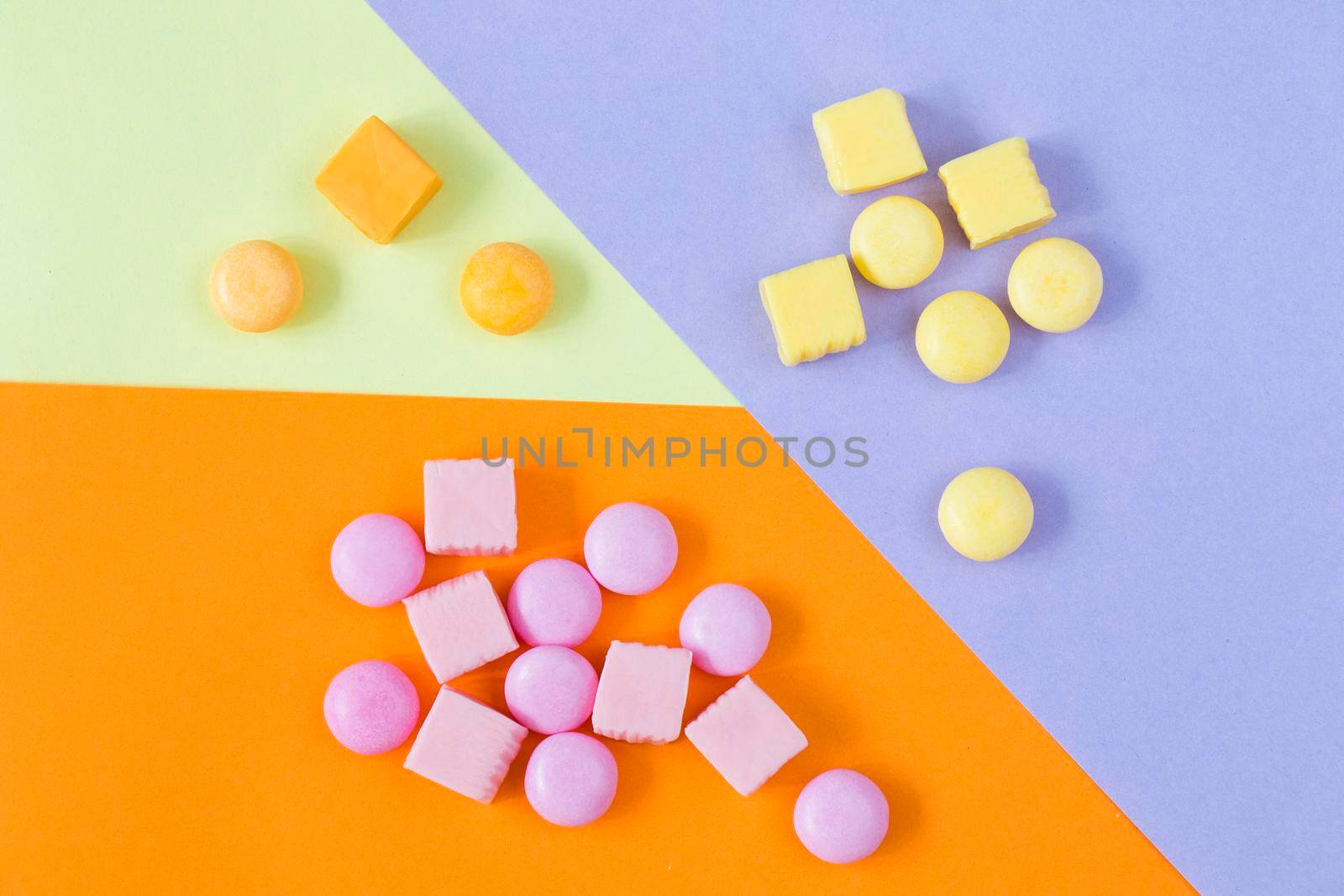 Sweet colorful confectionery, candy on the color background, high angle view