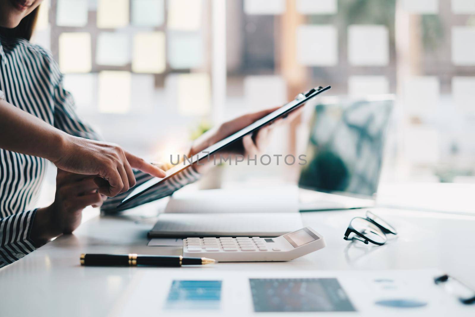 Analytics intelligence concept. Group of business people discuss current financial and economic on laptop for investment at the meeting. by itchaznong