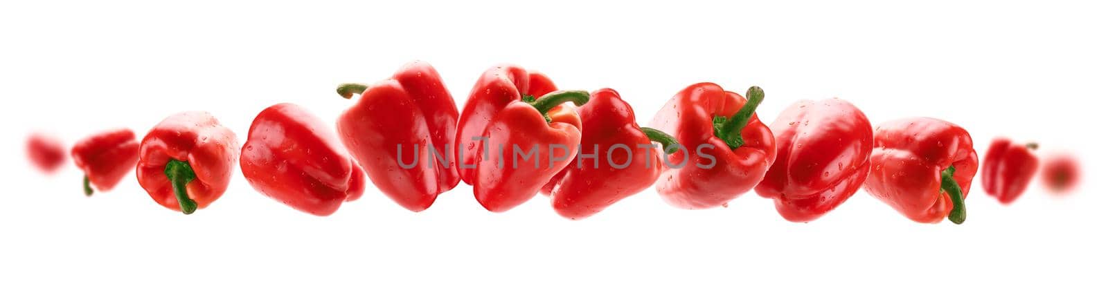 Red paprika levitates on a white background by butenkow