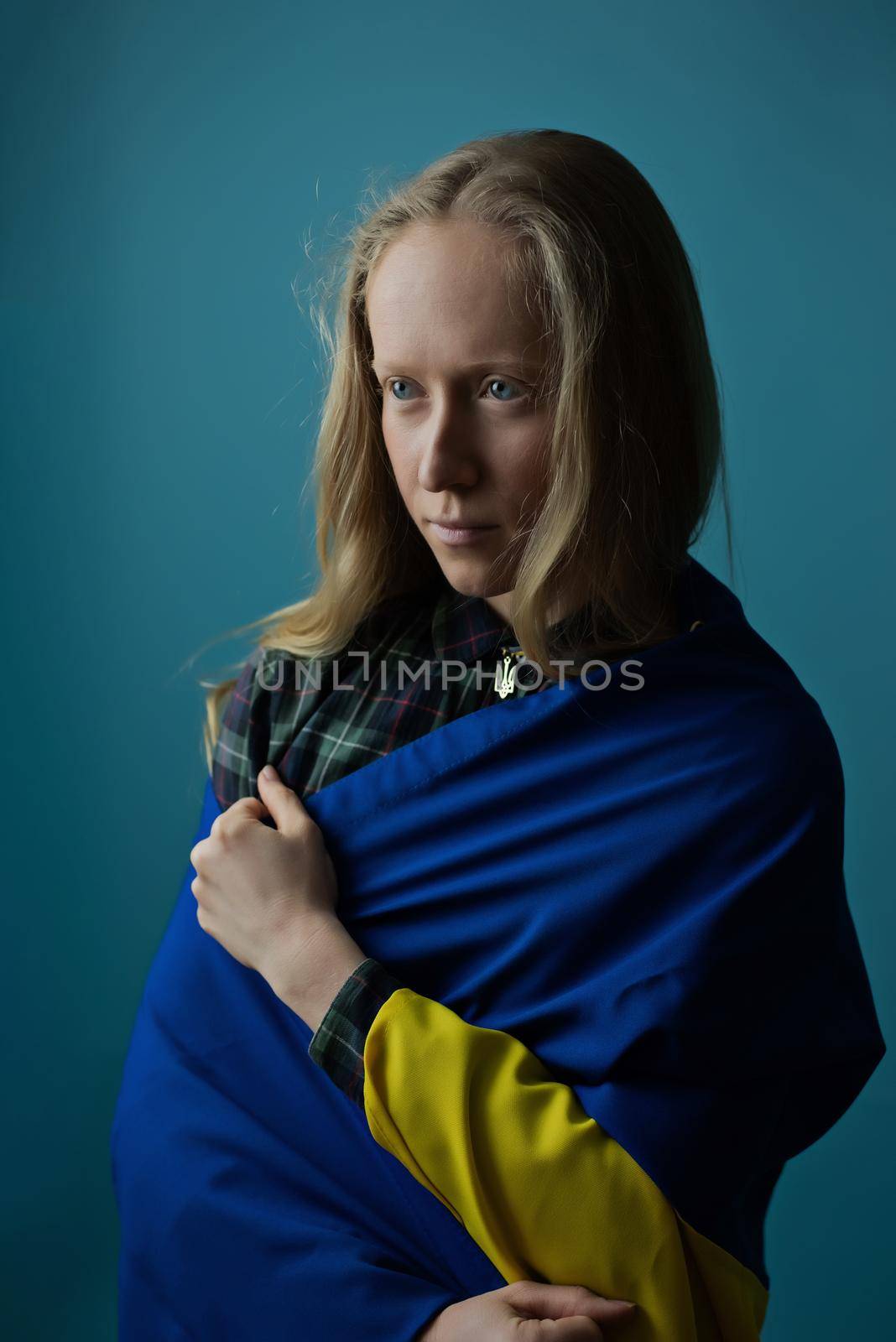 Young woman with Ukrainian flag by OksanaFedorchuk