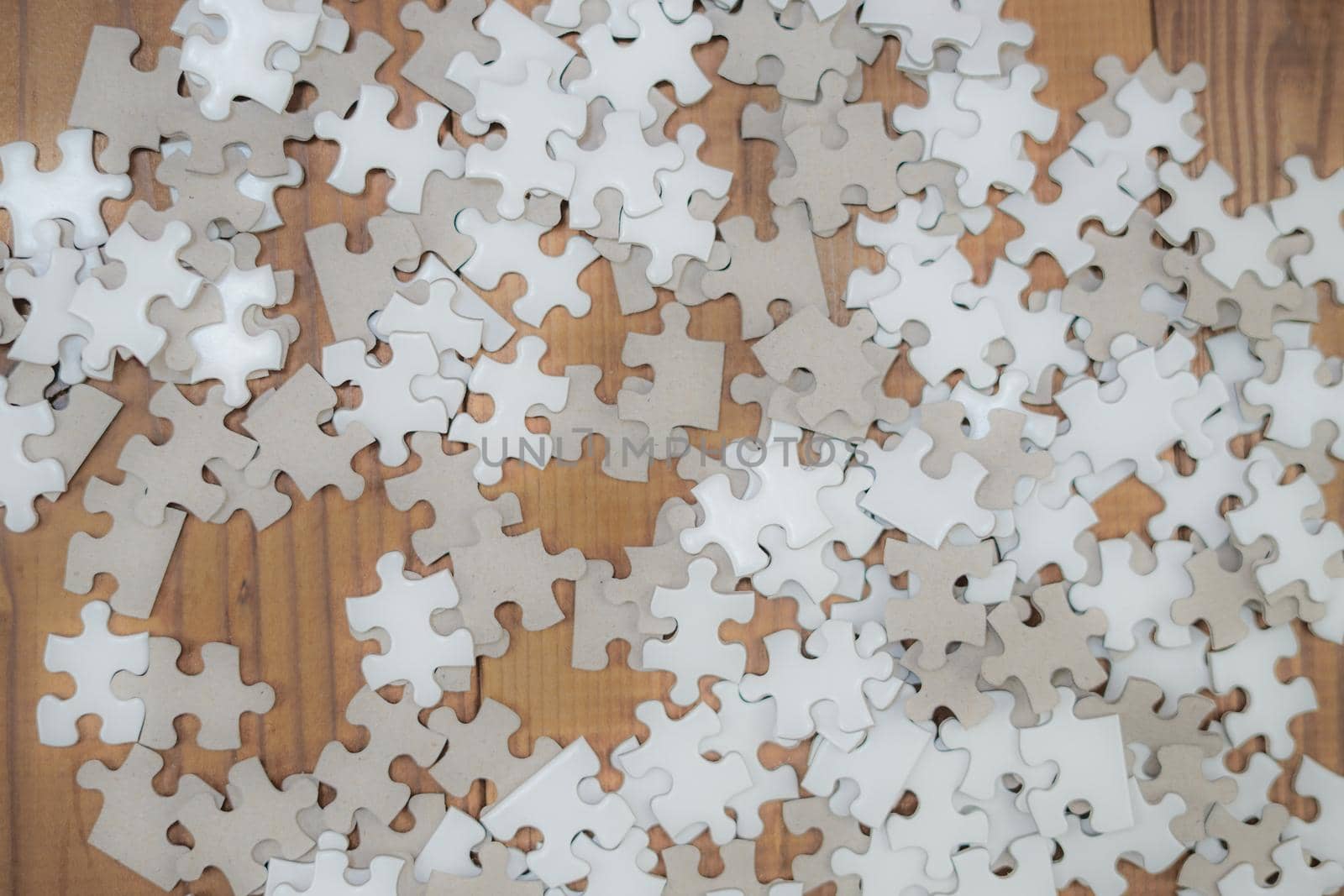 White jigsaw puzzle placed at desk by kanzilyou