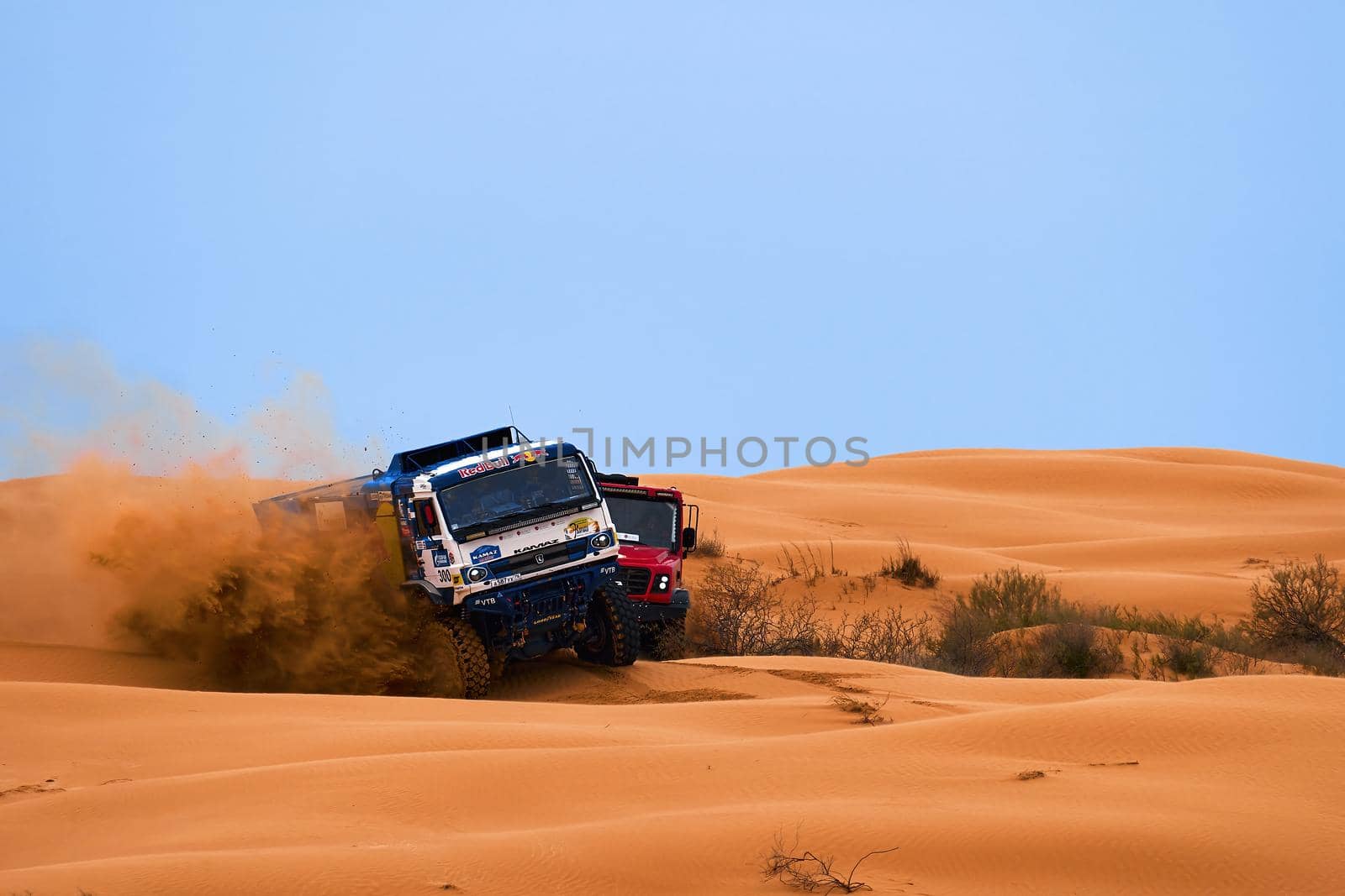 Sports truck KAMAZ gets over the difficult part of the route during the Rally raid in sand. THE GOLD OF KAGAN-2021. 26.04.2021 Astrakhan, Russia by EvgeniyQW