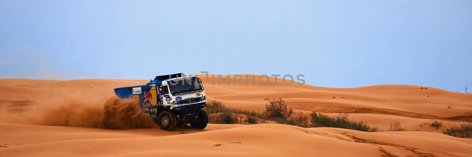 Sports truck KAMAZ gets over the difficult part of the route during the Rally raid in sand. THE GOLD OF KAGAN-2021. 26.04.2021 Astrakhan, Russia by EvgeniyQW