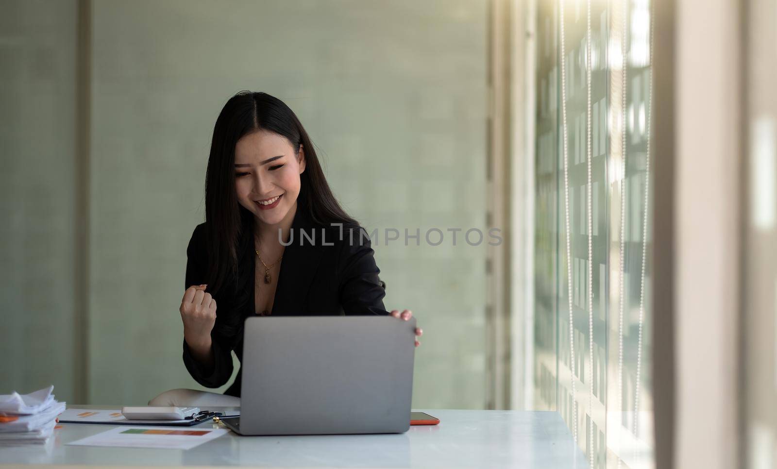 Excited asian female feeling euphoric celebrating online win success achievement result, young woman happy about good email news, motivated by great offer or new opportunity, passed exam, got a job.