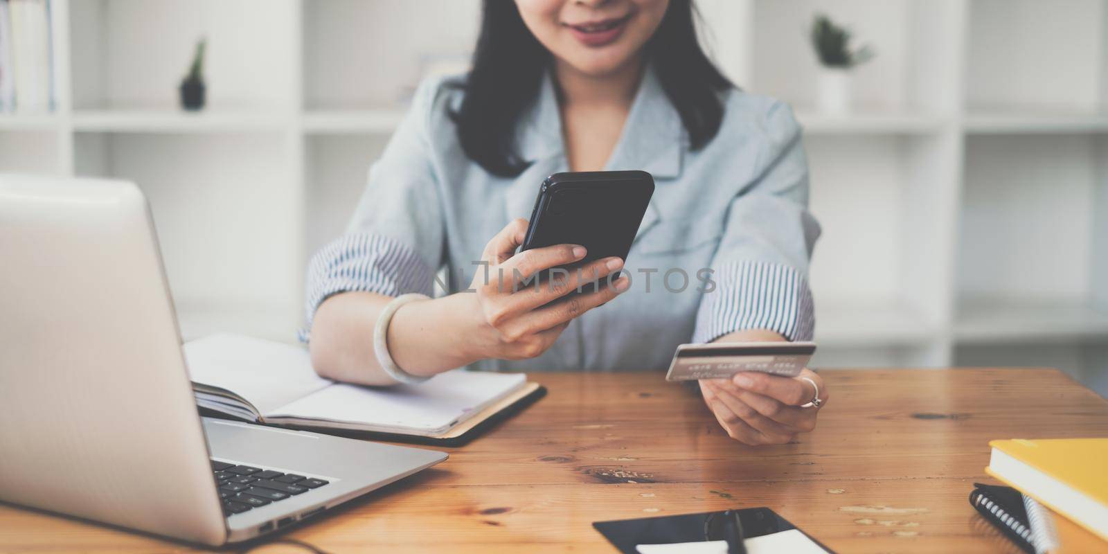 Woman enjoy with online shopping application and typing credit card for fill number to payment with virtual digital asset and metaverse. by itchaznong