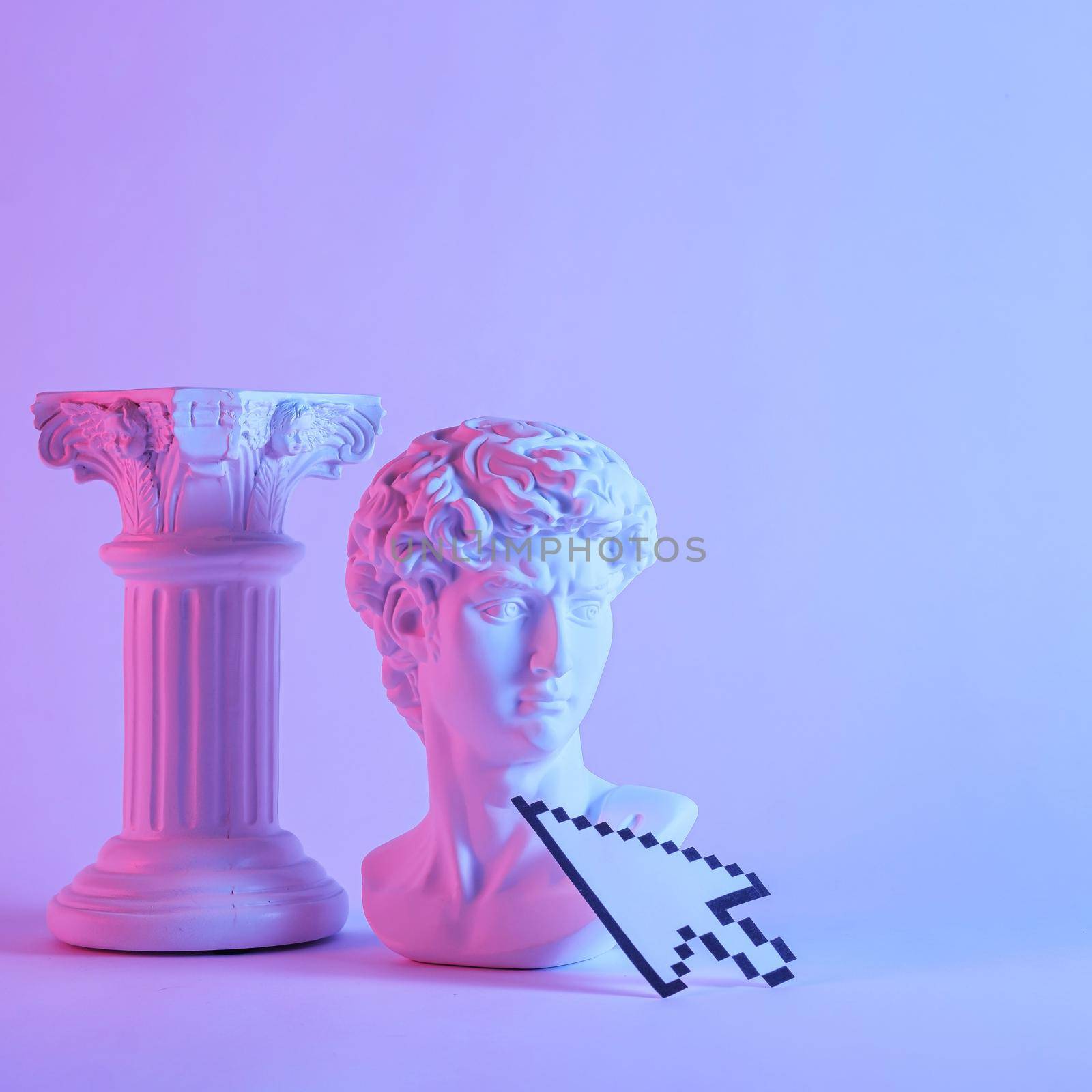 Antique style bust of young Grecian or Roman man with pedestal standing side by side over a purple monotone background