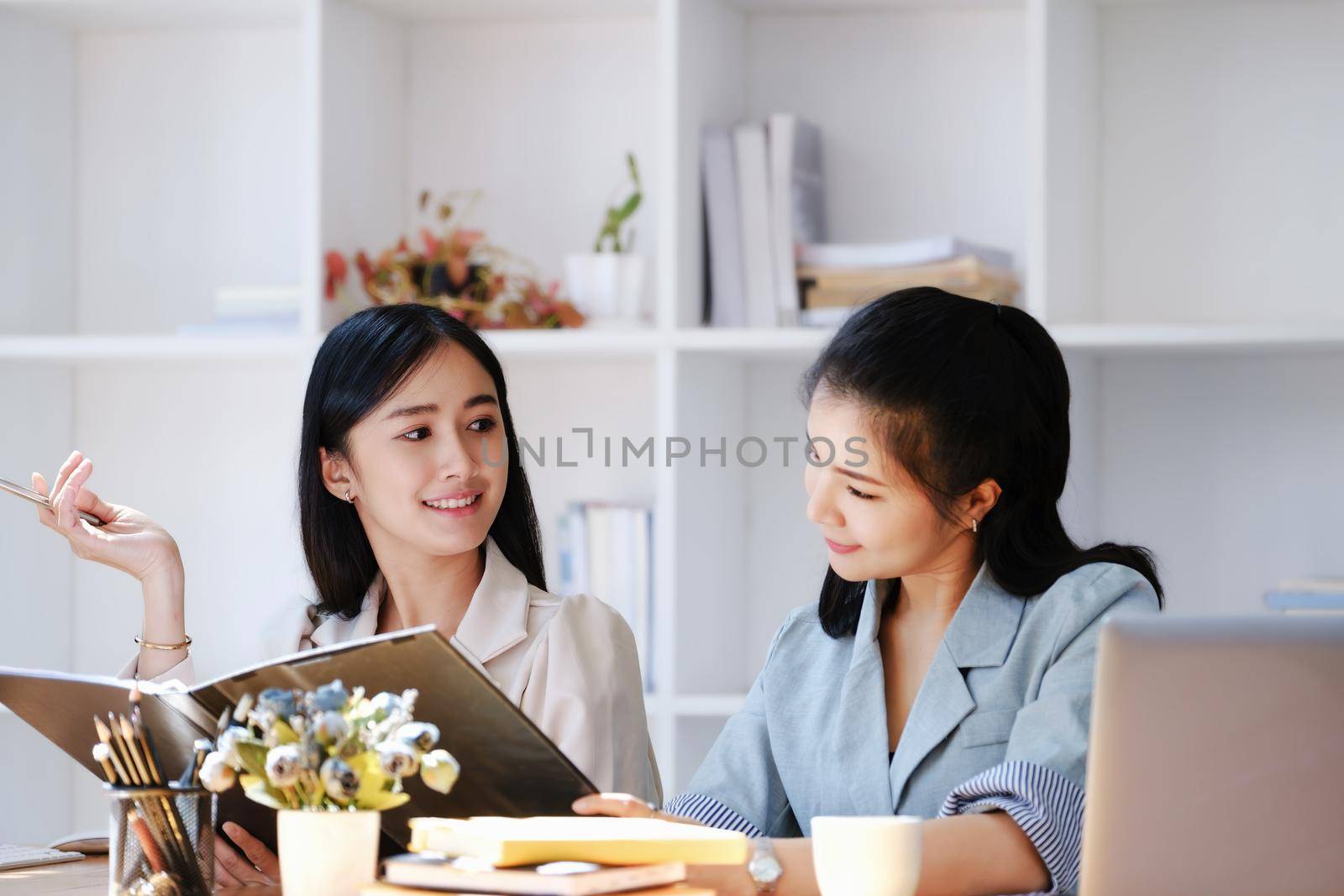 Consultation concept, contract signing, insurance, female employee holding a pen is offering contract documents to customers to sign important documents
