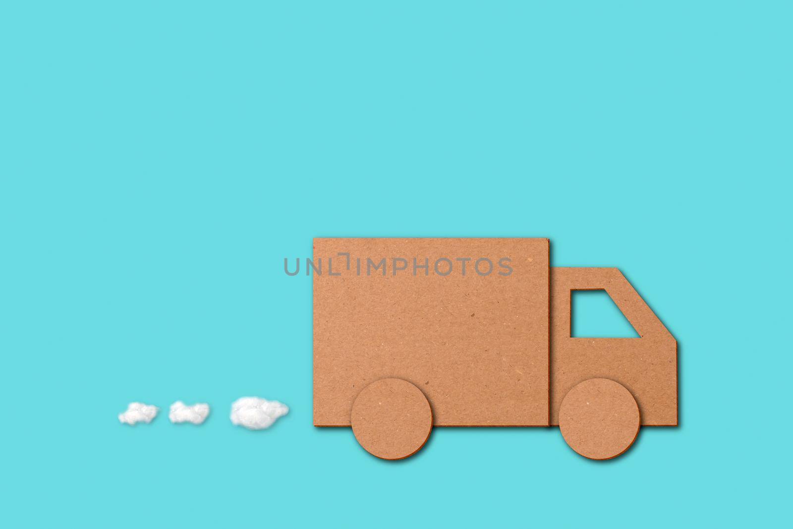 Small cutout of a van over a blue background in a concept of shopping, business deliveries and orders