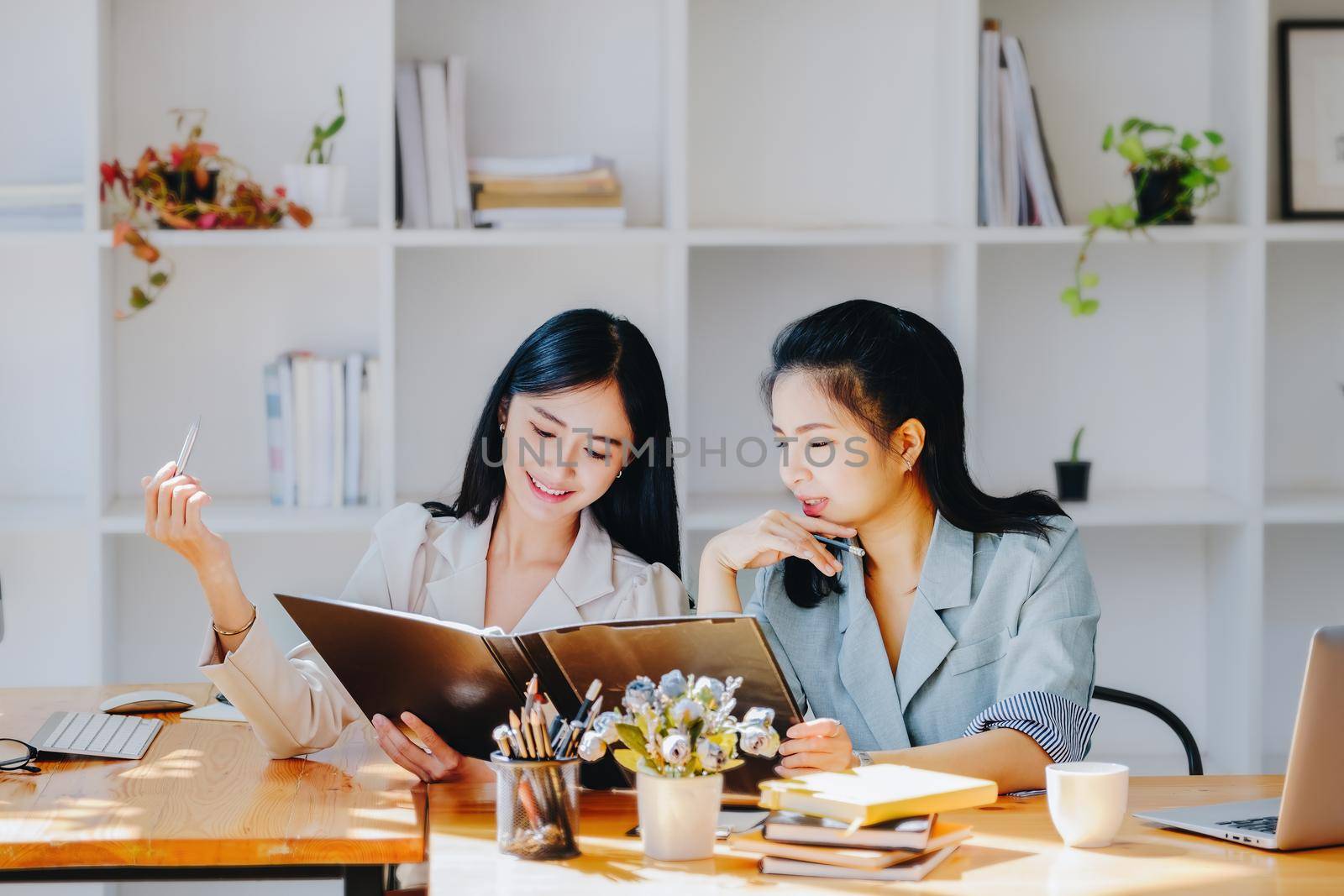 Consultation concept, contract signing, insurance, female employee holding a pen is offering contract documents to customers to sign important documents