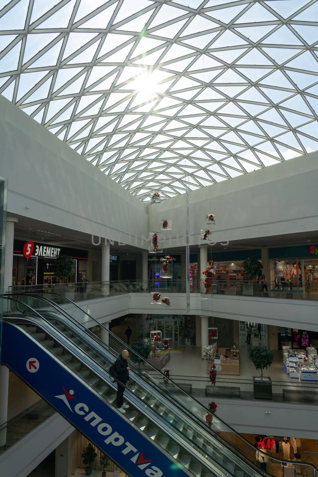 Grodno, Belarus - April 07, 2021: View on escalator in modern shopping mall Triniti