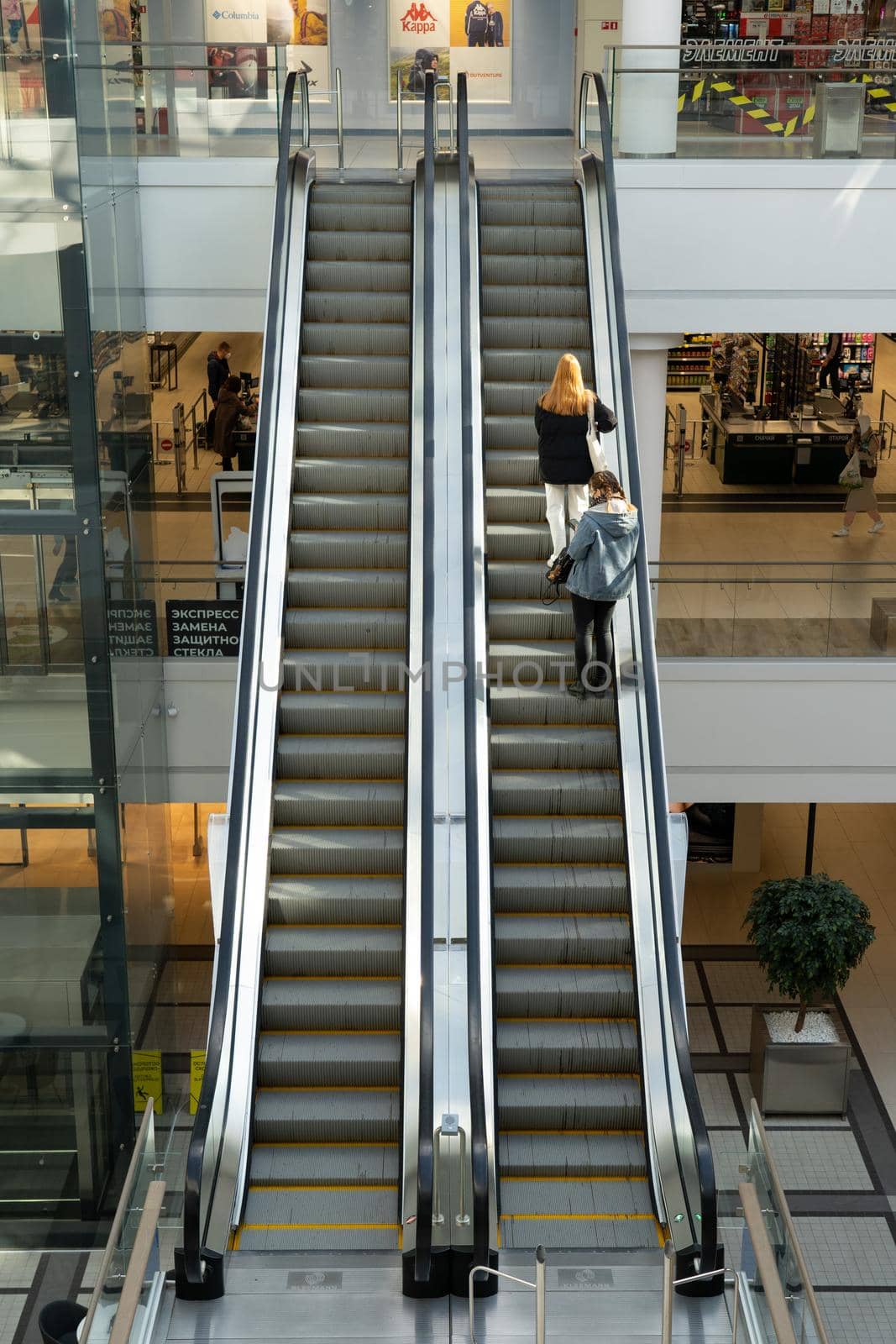 Grodno, Belarus - April 07, 2021: View on escalator in modern shopping mall Triniti