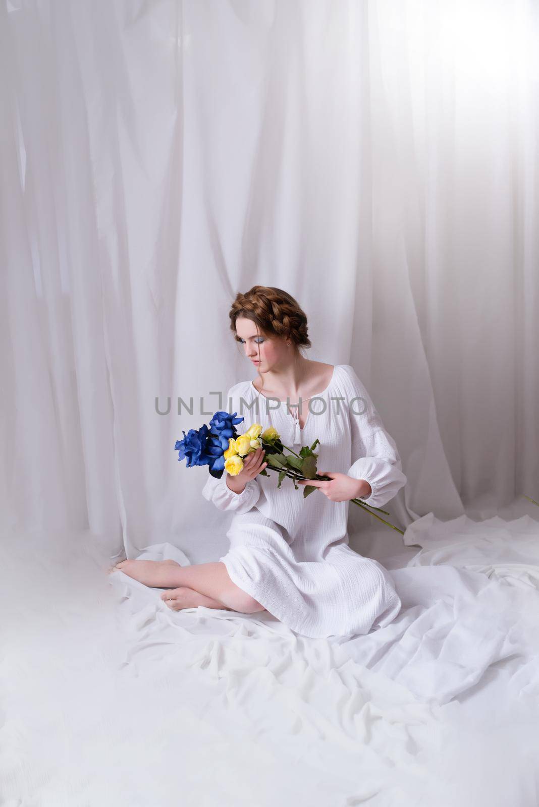 Ukrainian girl with blue yellow flowers in white by OksanaFedorchuk