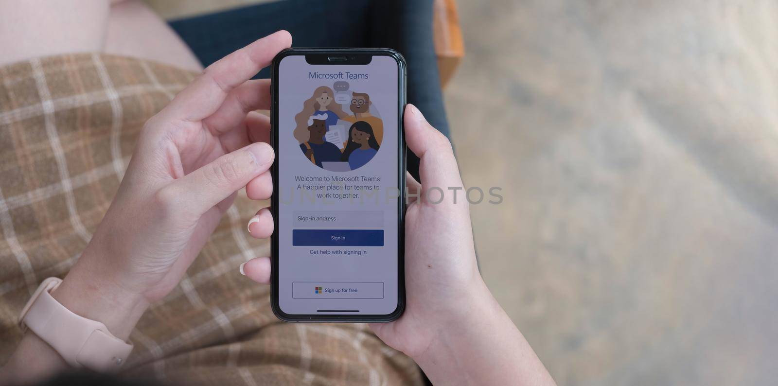 CHIANG MAI, THAILAND - NOV 14, 2021 : A working from home employee is downloading the Microsoft Teams social platform, ready for remote working in isolation from home.