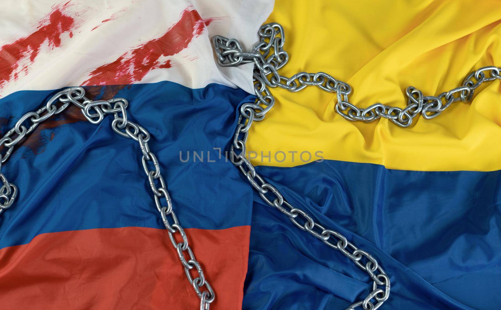 flags of russia and Ukraine with a metal chain