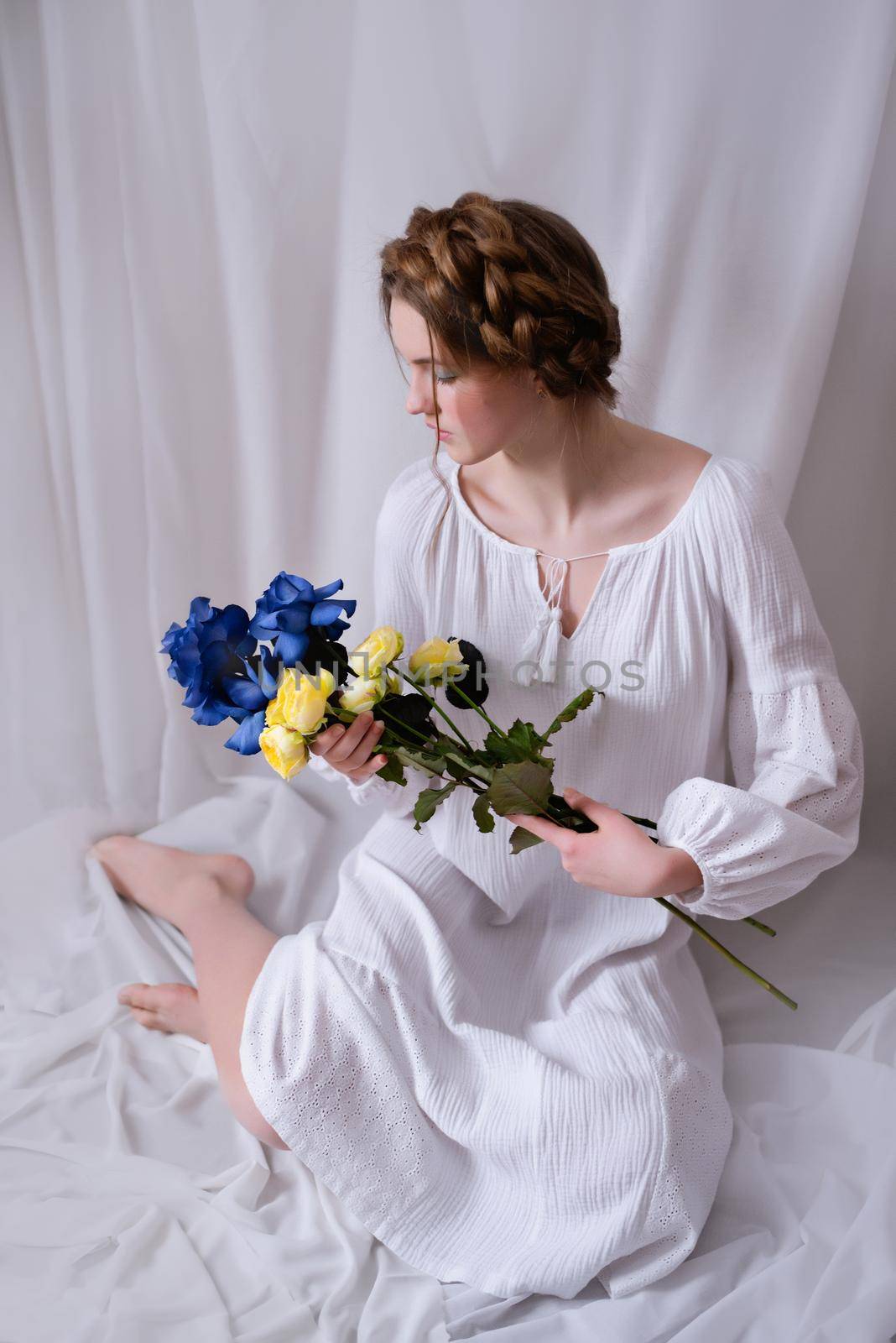 Ukrainian girl with blue yellow flowers in white by OksanaFedorchuk