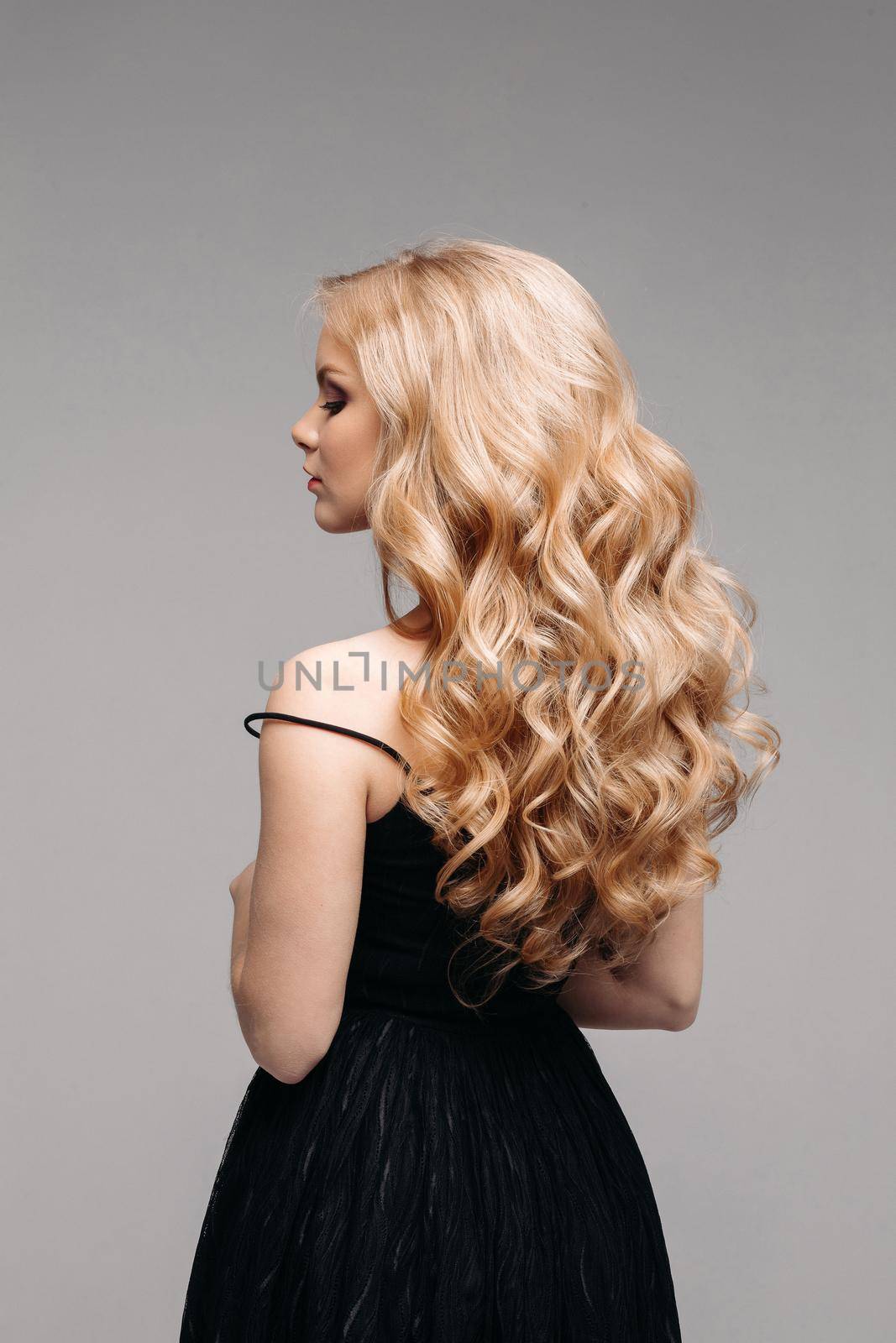 Stunning woman with perfect wavy blonde hair. by StudioLucky