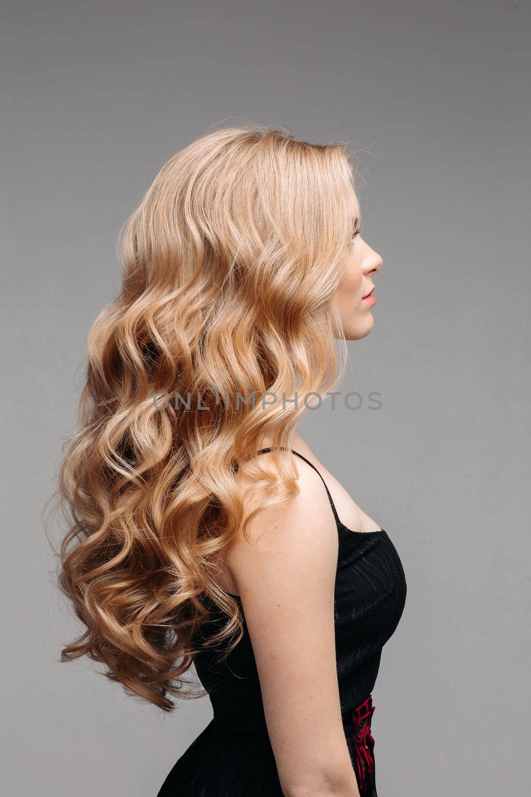 Stunning woman with perfect wavy blonde hair. by StudioLucky