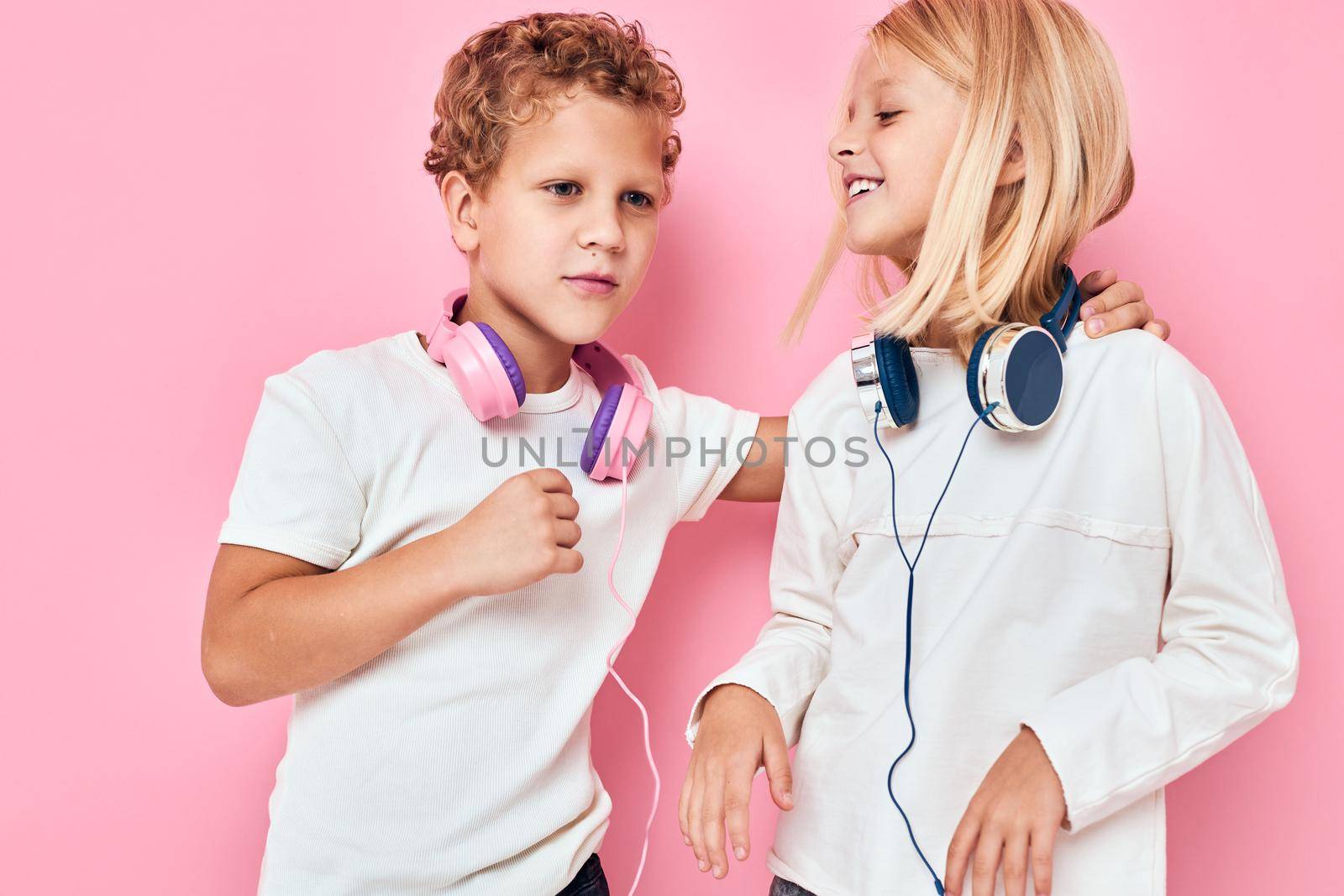 Funny children listening to music isolated background by SHOTPRIME