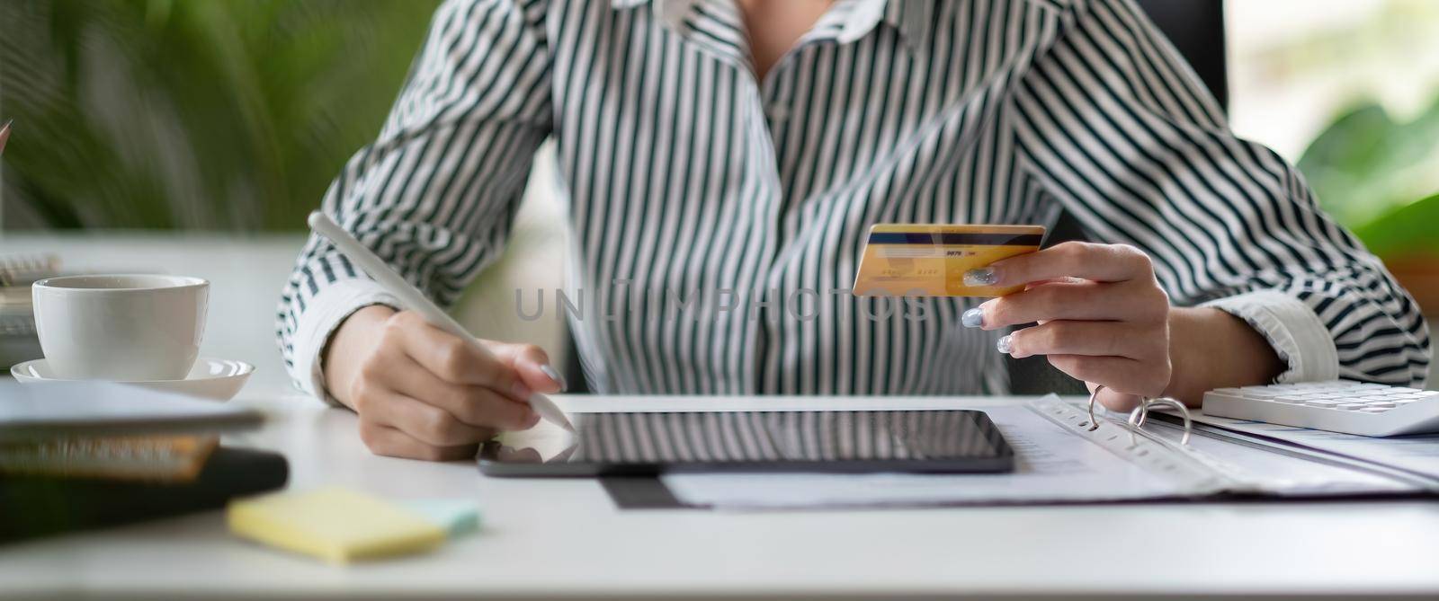 technology, asian woman online shopping concept - happy smiling woman with tablet pc computer and credit card at home.