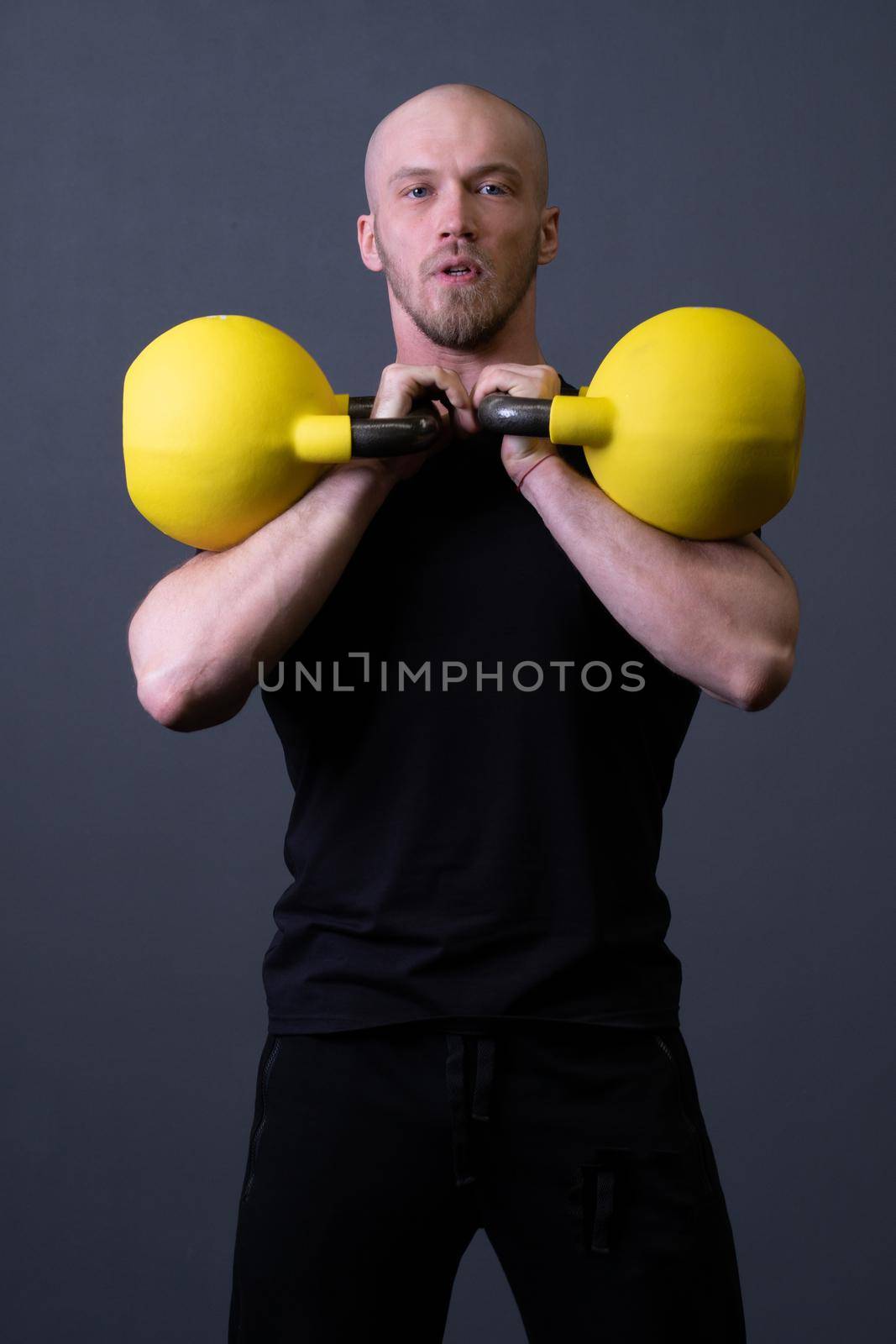 Guy with a yellow kettlebell gym anonymous yellow man, from sporty lifestyle from strong and up weightlifting, malaysian filipino. Living interval endurance, muscle hiit