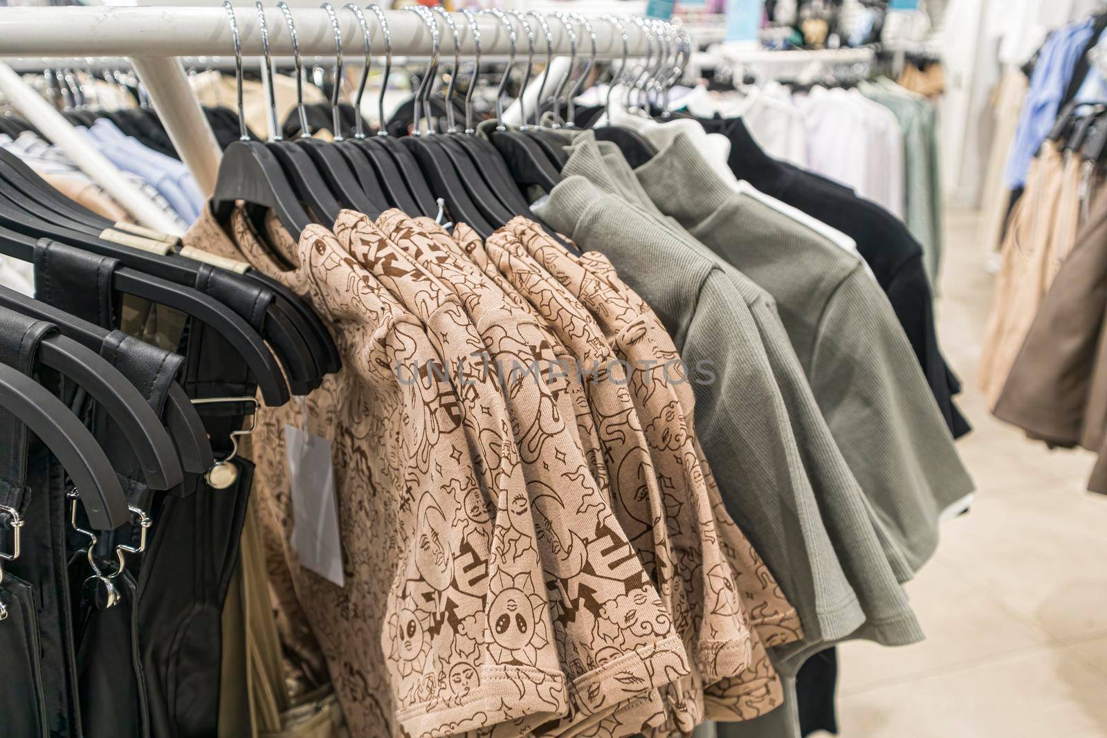 men's t-shirts on hangers in the mall. photo