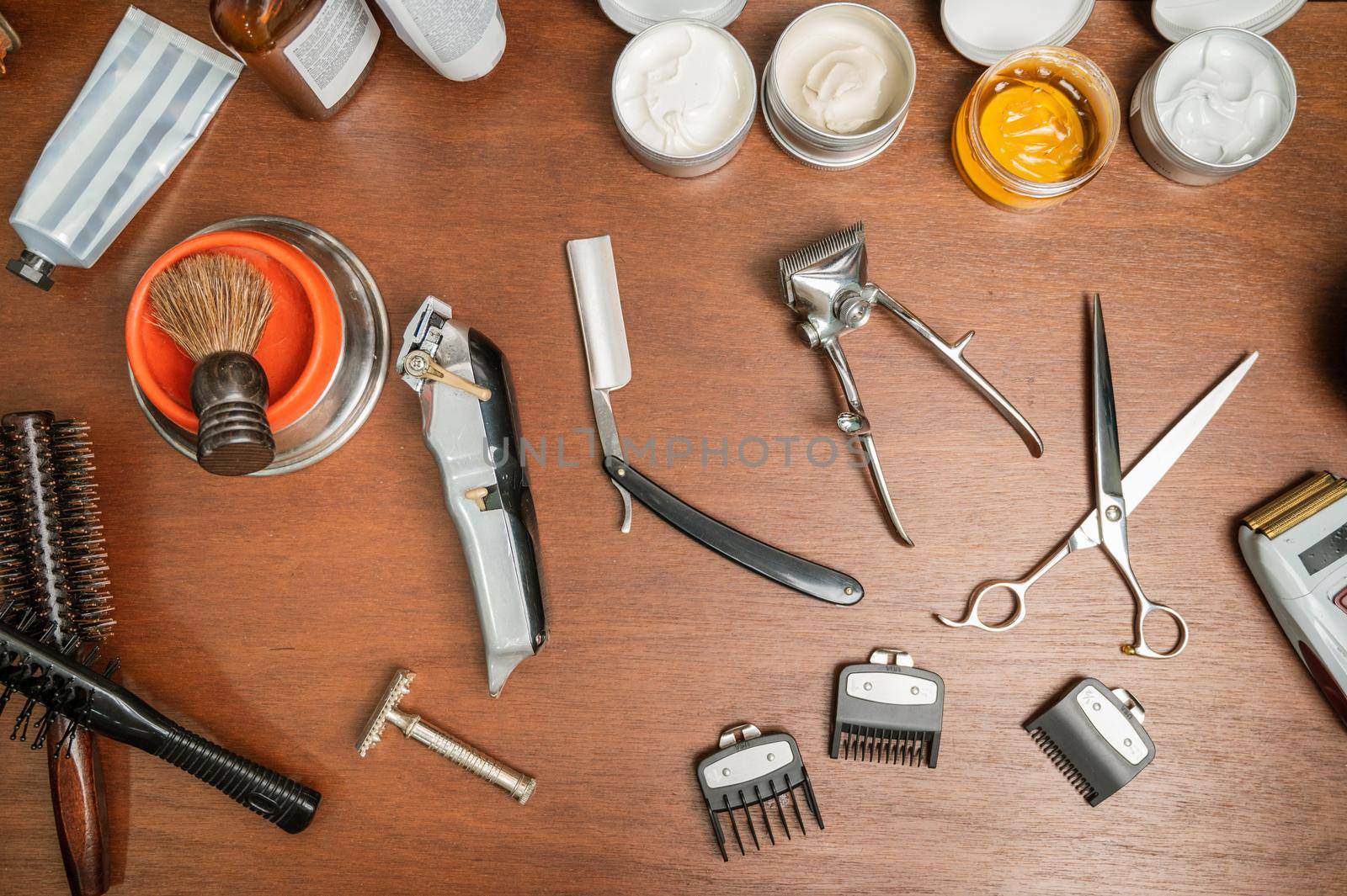 Top view barber tools on the shelf in the barbershop. by HERRAEZ