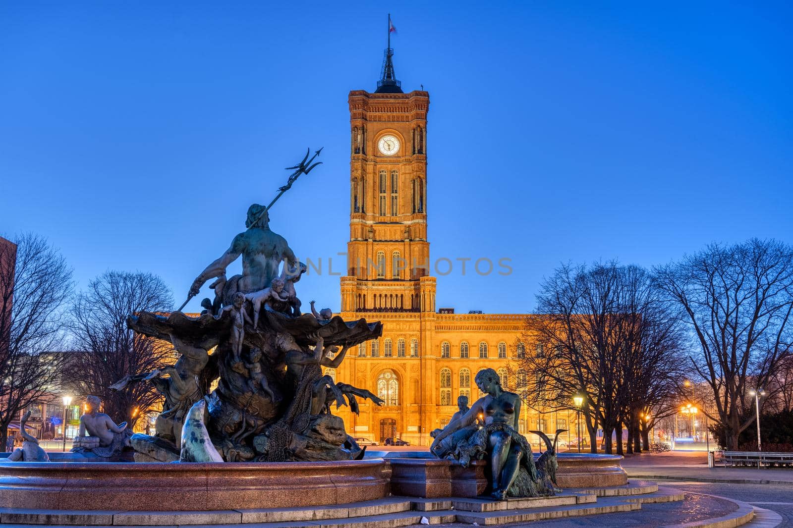 The famous Rotes Rathaus and the Neptune fountain in Berlin at twilight