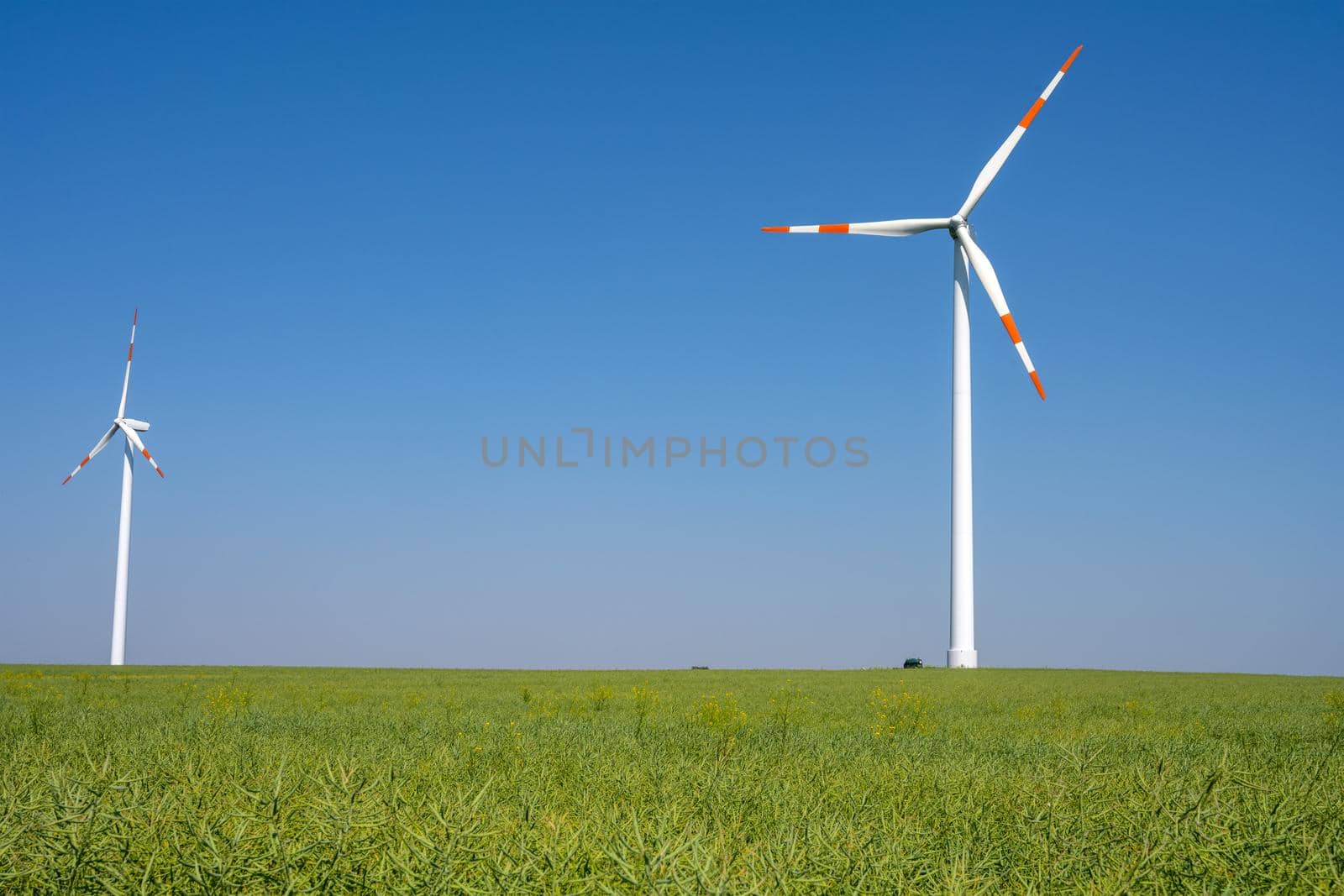 Agricultural field with wind turbines seen in Germany
