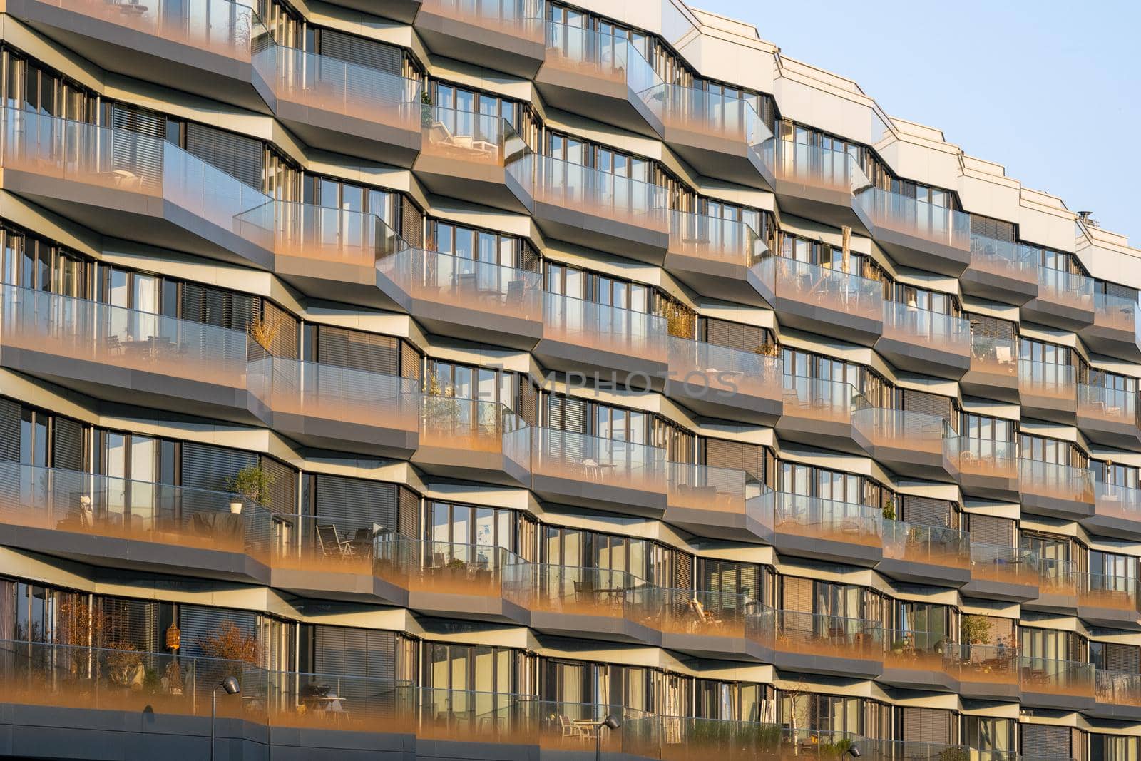 Facade of a modern apartment building with a lot of glass seen in Berlin, Germany