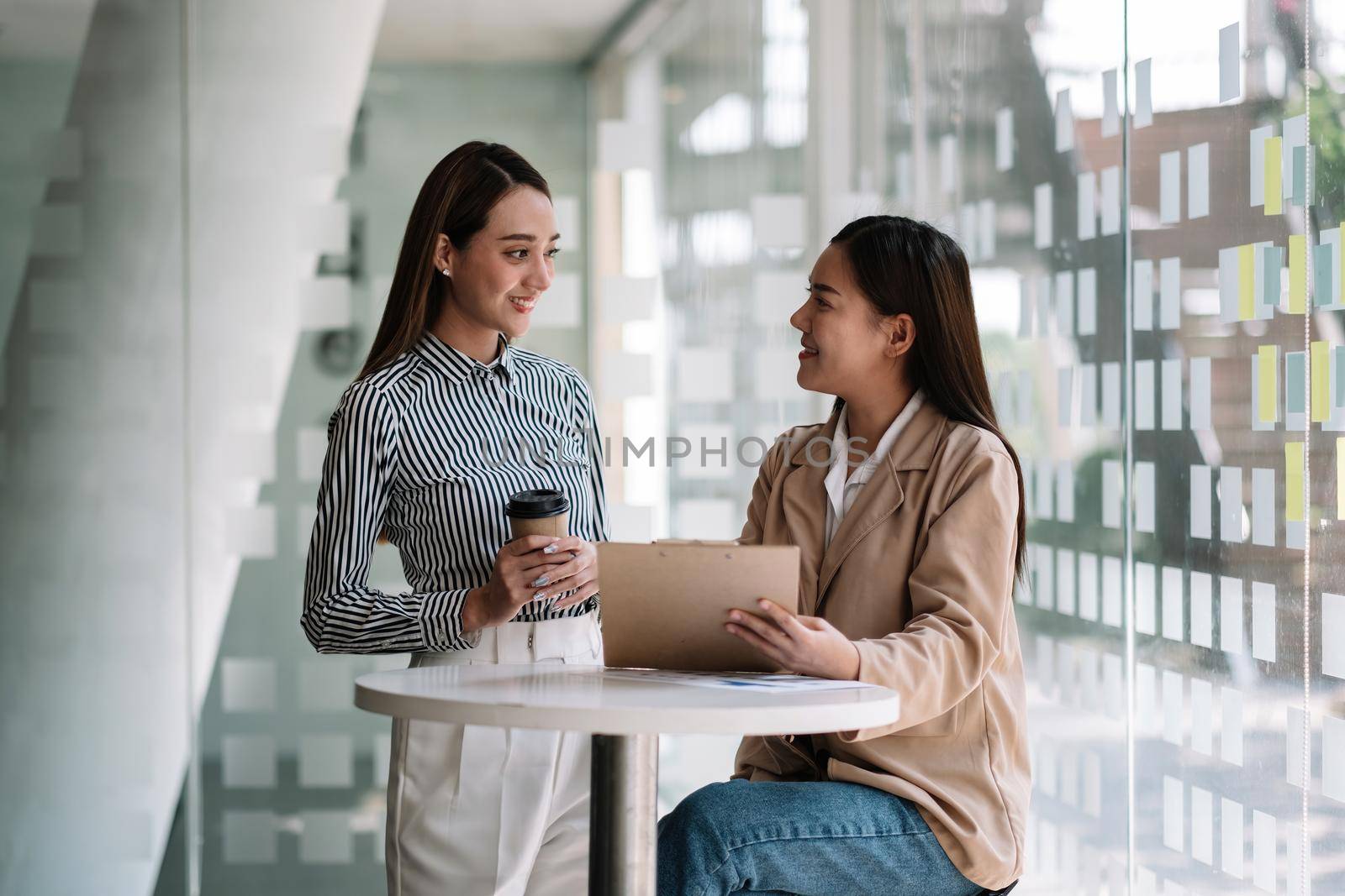 Group of asian businesswoman and Accountant checking data document on paperwork chart report for investigation of corruption account.