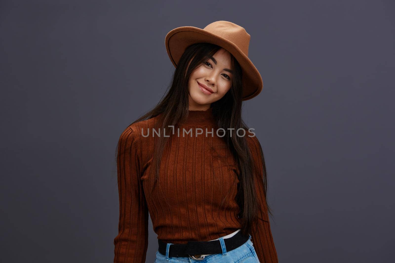 woman brown hat hand gestures brown sweater fashion emotions isolated background. High quality photo