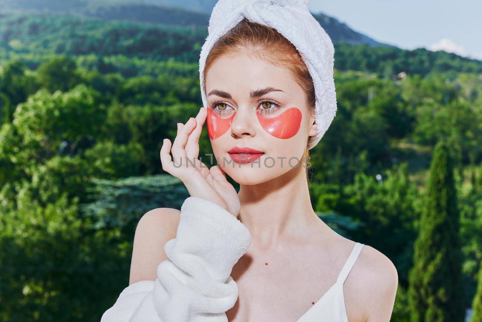 Portrait woman with patches on the face in a robe close-up. High quality photo