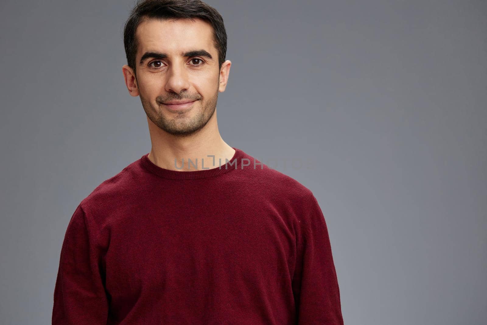 handsome man in a red sweater hand gesture posing self confidence isolated background by SHOTPRIME