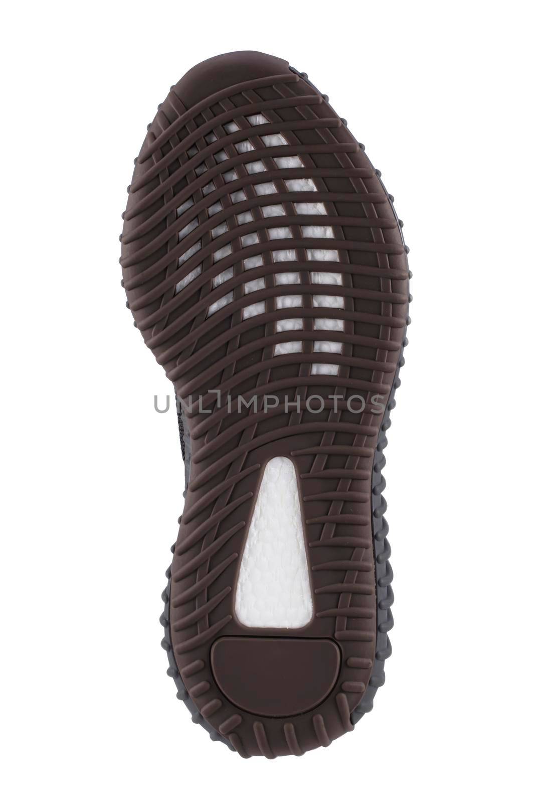 The semi-veritan sole of the shoe is black with white stripes.