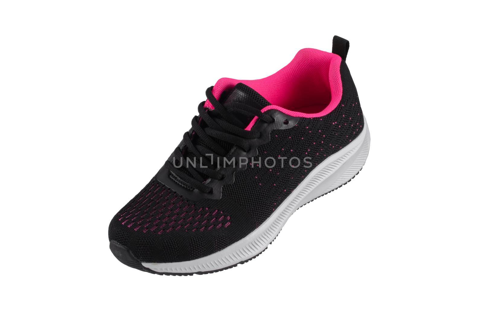 Black sneaker made of fabric with pink inserts with a white sole on a white background.