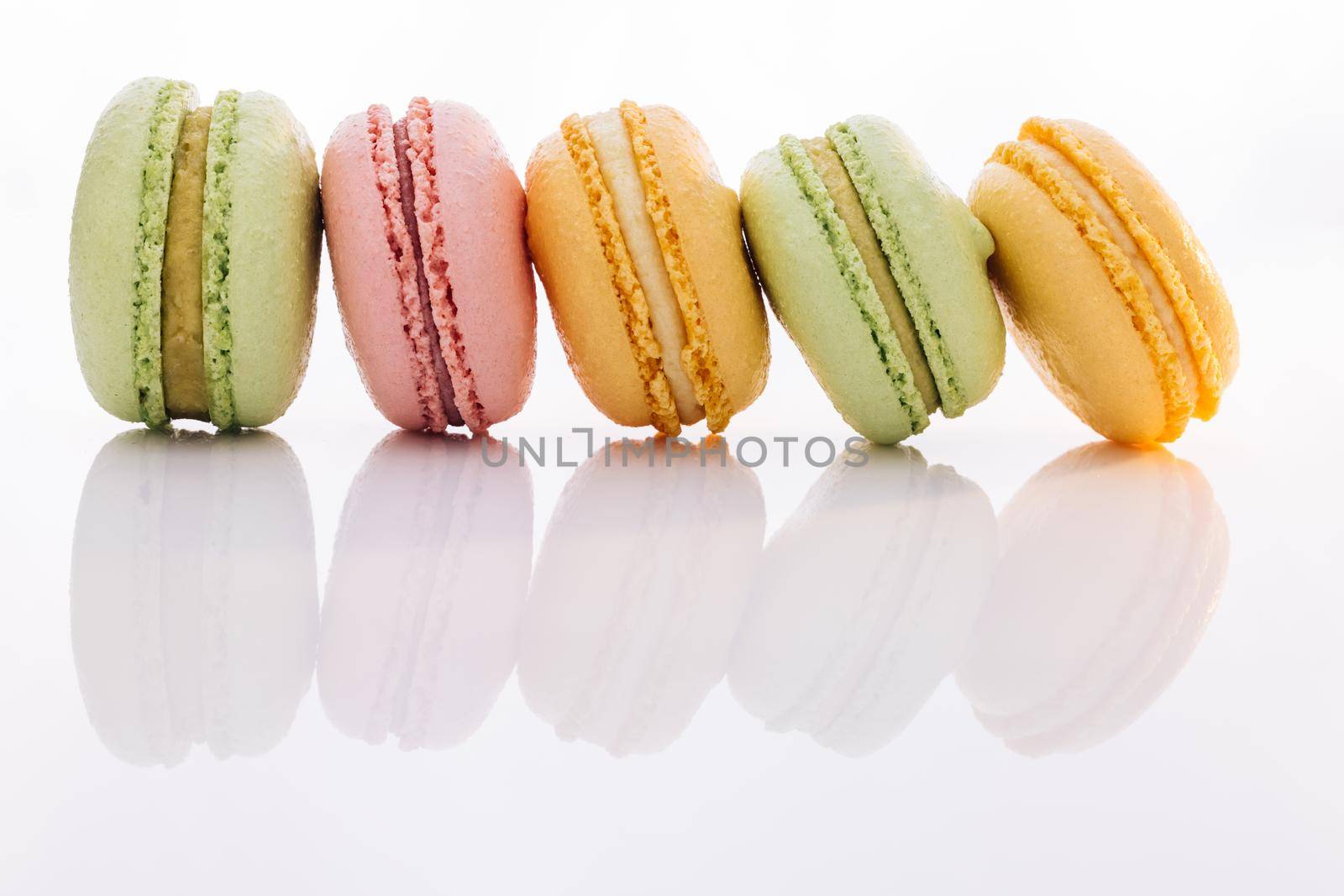Tasty sweet color macaron. Colorful macarons dessert. French macarons on white background. Different colorful macaroon.