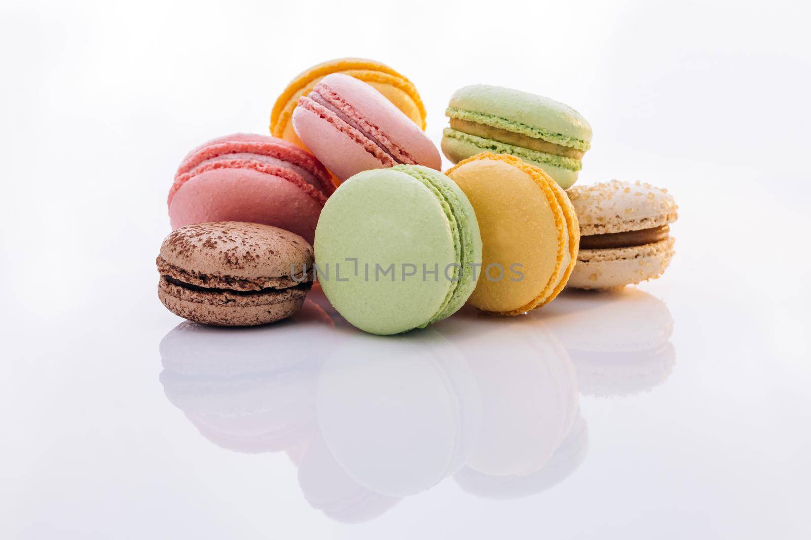 Multicolored Macarons Cookies. Multicolor macarons , French macaroon, greedy pastry. Food concept. by uflypro