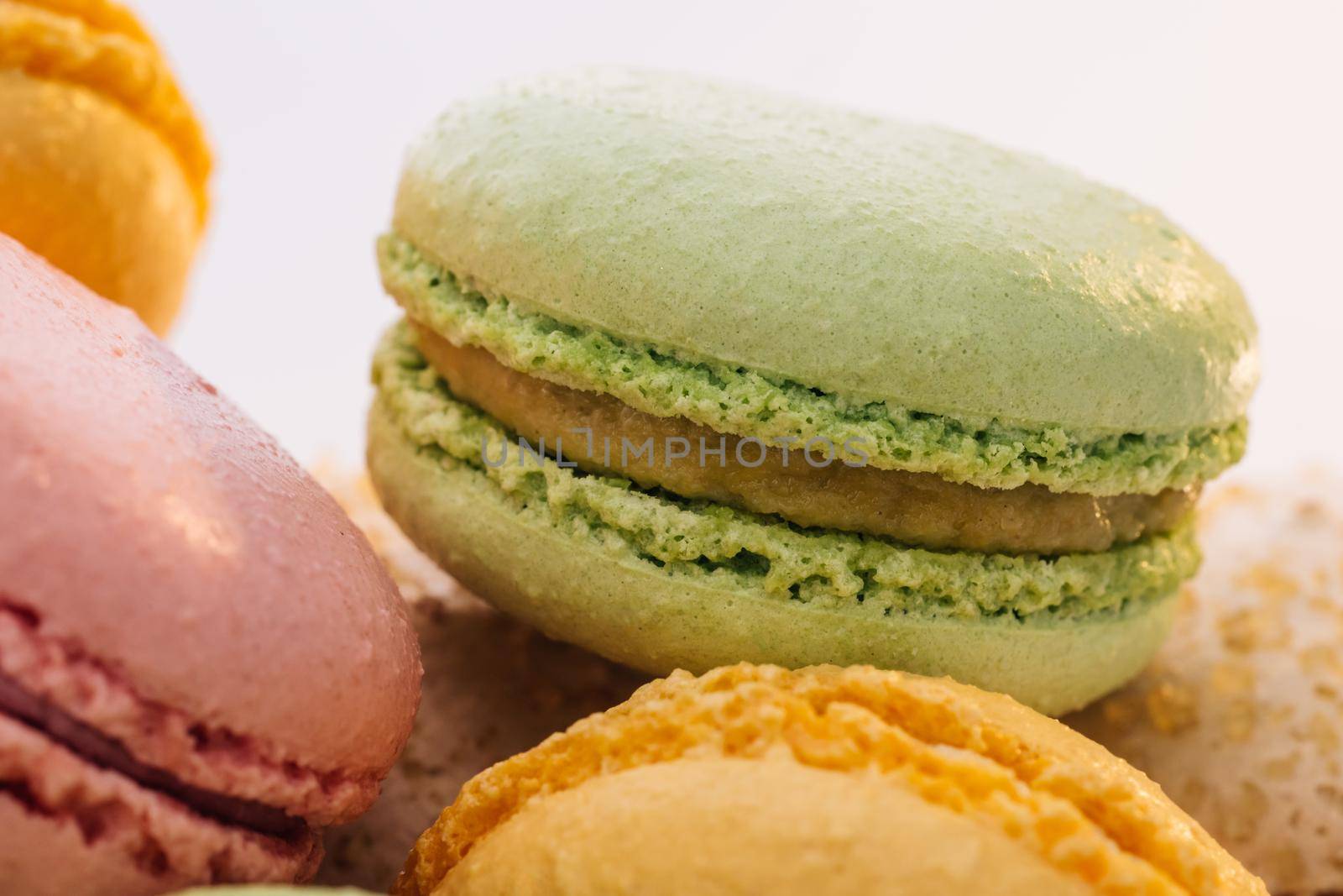 Close up of Multicolored Macarons Cookies. Multicolor macarons , French macaroon, greedy pastry. Food concept