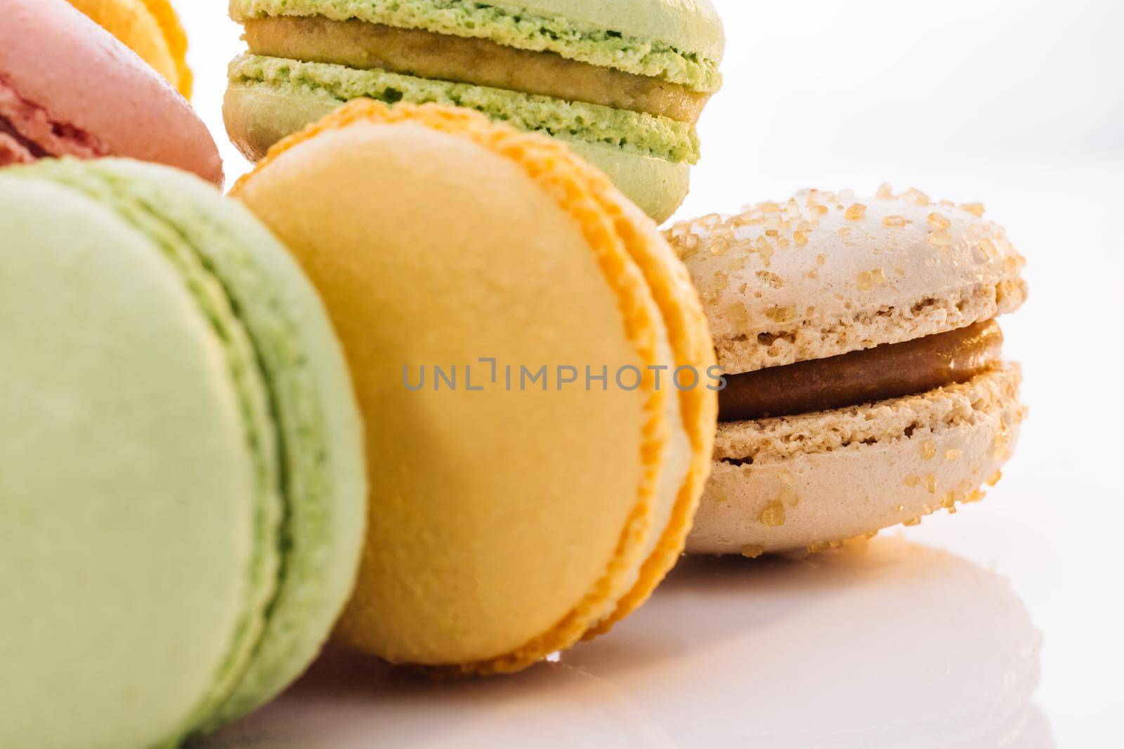 Multicolor macarons , French macaroon, greedy pastry. Close up of Multicolored Macarons Cookies. Food concept. by uflypro