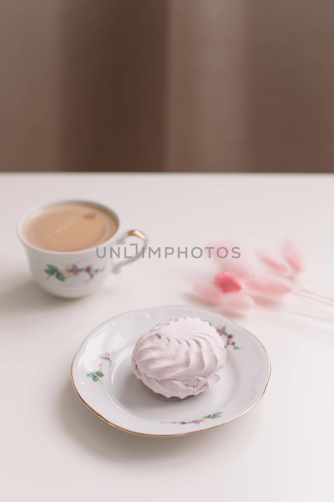 Good morning banner. Cup of coffee and homemade dessert zephyr. Top view. Food Photography with copy space. A cup of coffee and an airy marshmallow. Culinary background.