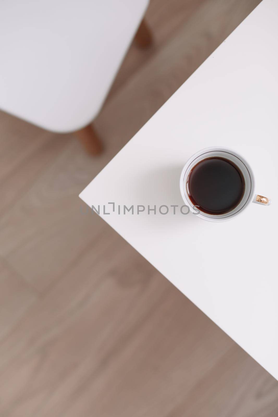 Good morning banner. Cup of coffee on a table. Minimal concept. Food Photography with copy space.