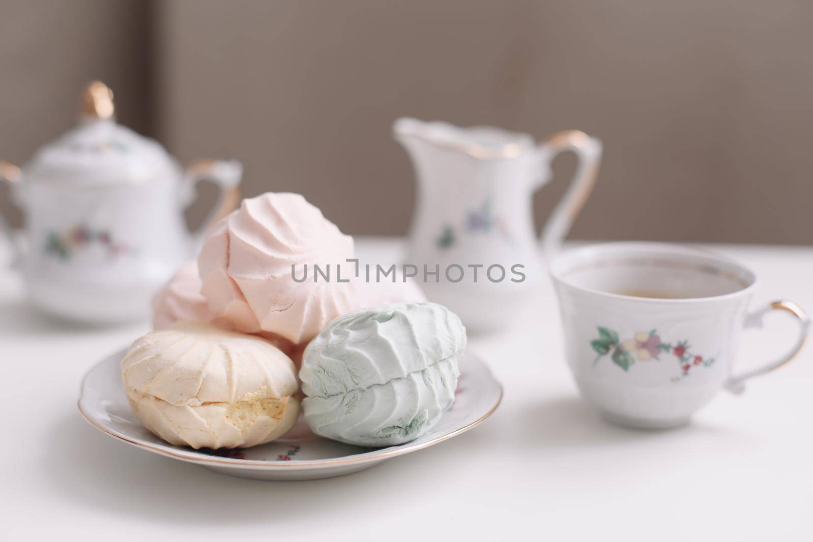 Good morning banner. Cup of coffee and homemade dessert zephyr. Top view. Food Photography with copy space. A cup of coffee and an airy marshmallow. Culinary background.