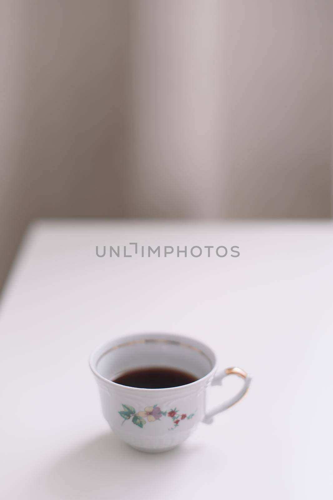 Good morning banner. Cup of coffee on a table. Minimal concept. Food Photography with copy space.