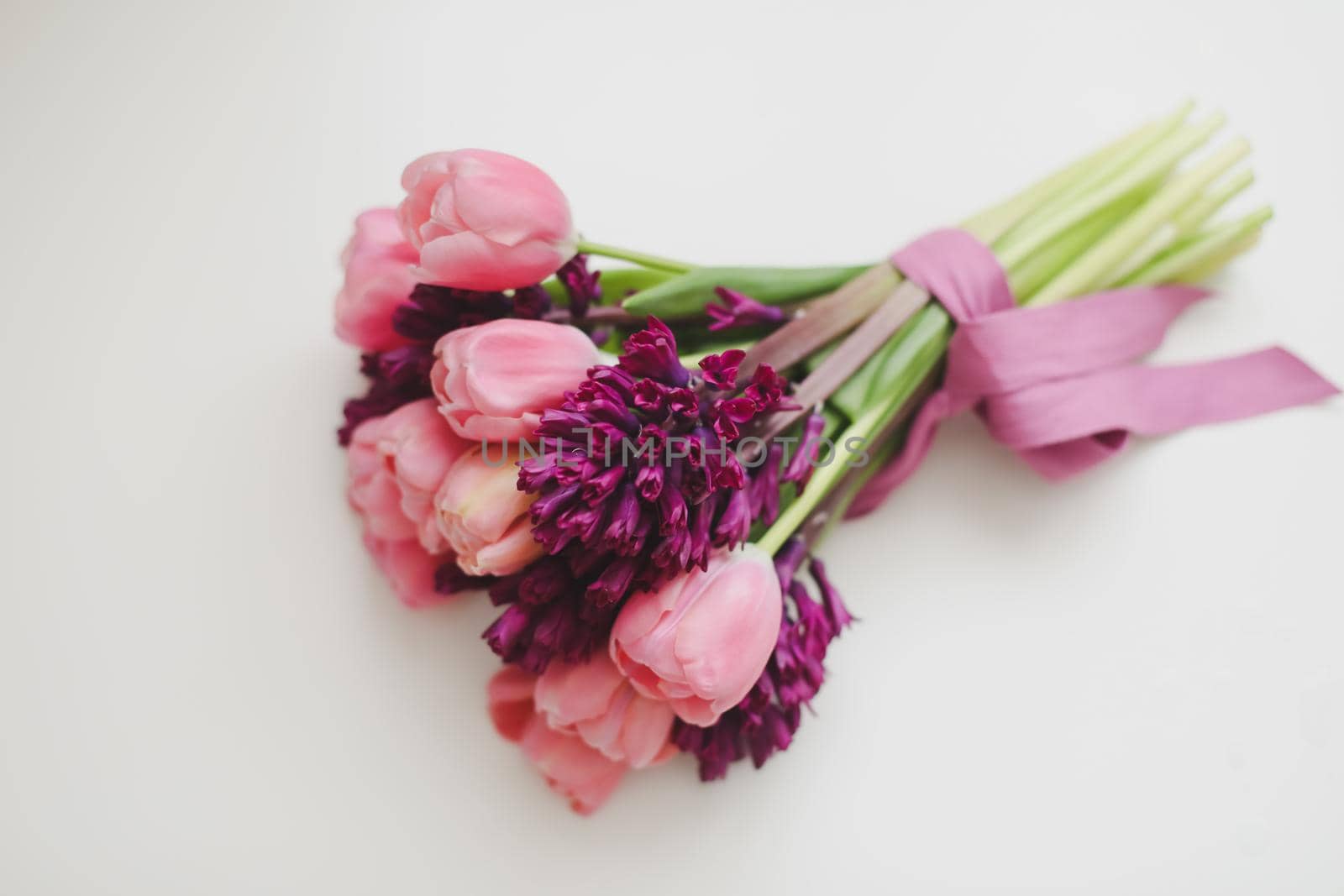 pink tulip bouquet in daylight. Spring stll life, birthday, Easter concept.