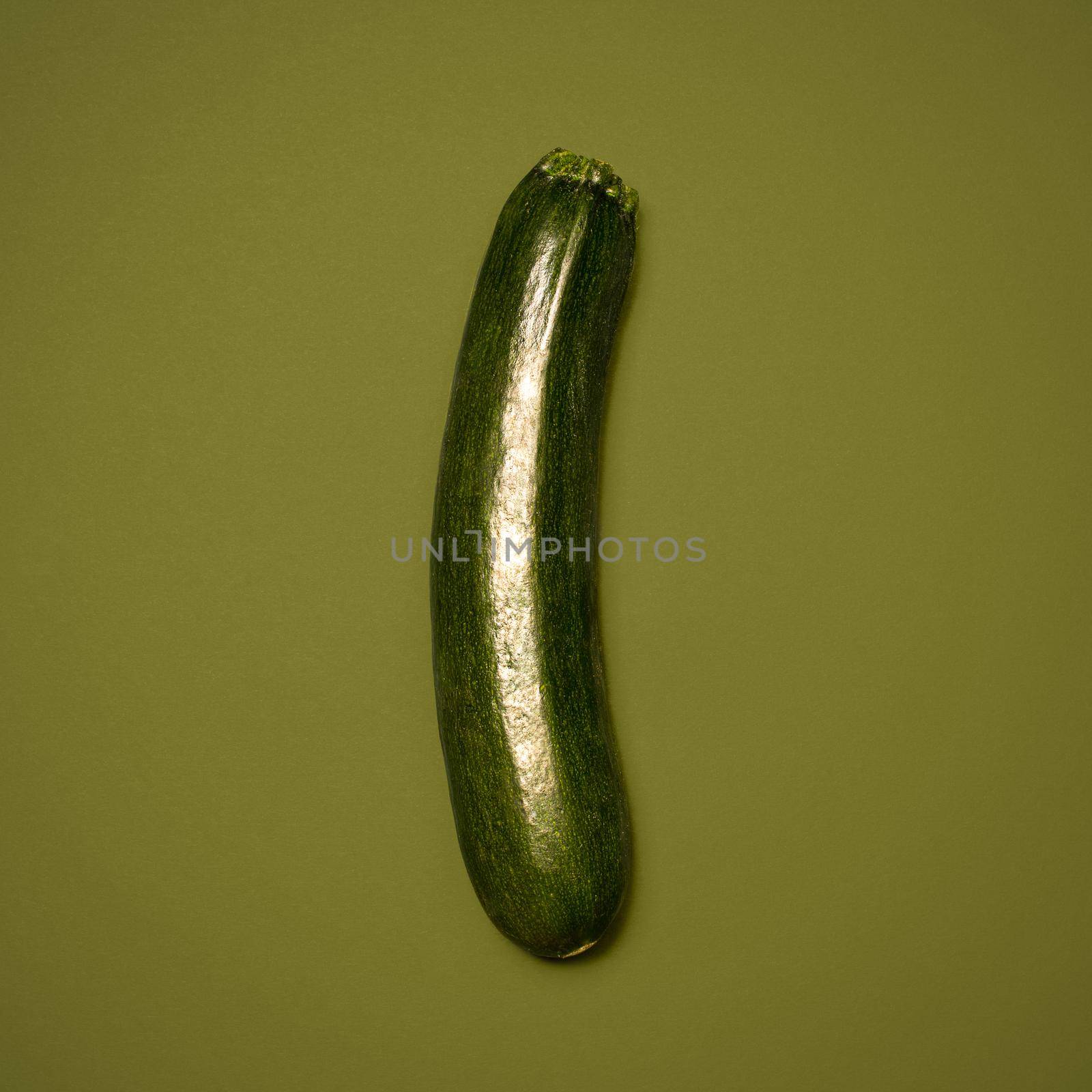 Shot of a green marrow against a studio background.