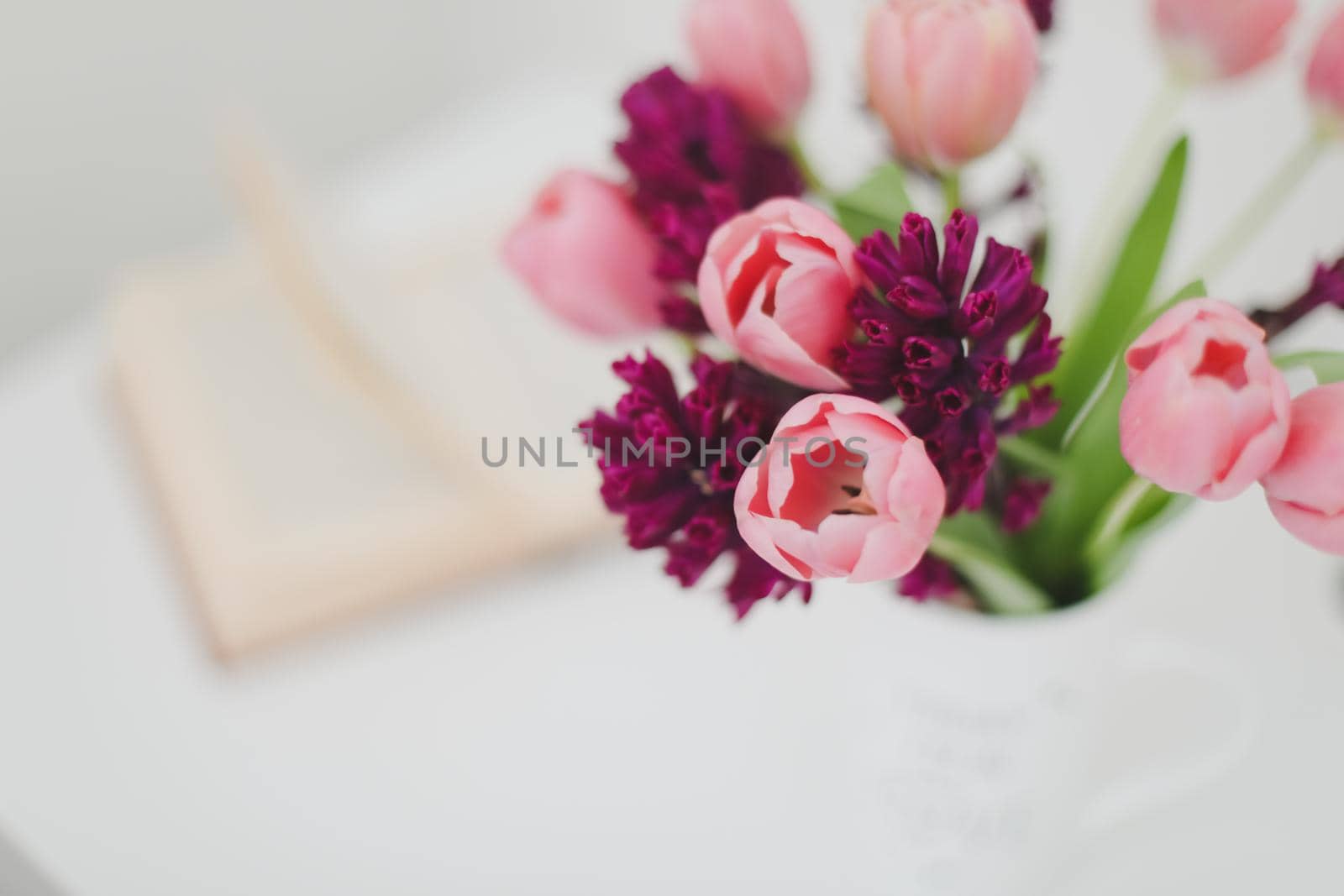 pink tulip bouquet in daylight. Spring stll life, birthday, Easter concept by paralisart